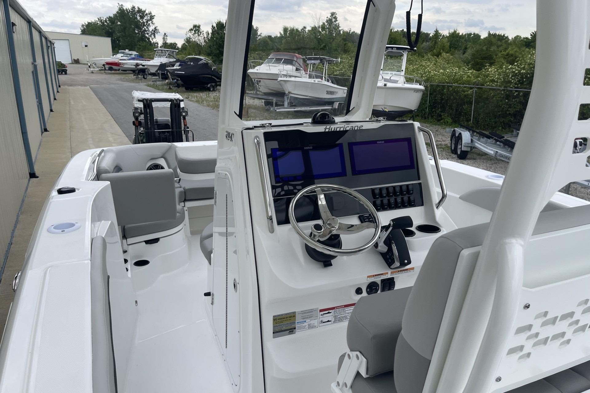 2026 Hurricane Center Console 24 OB boat with modern dashboard and seating.