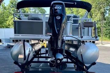 2026 Sun Tracker Bass Buggy 18 DLX pontoon boat with powerful outboard motor.