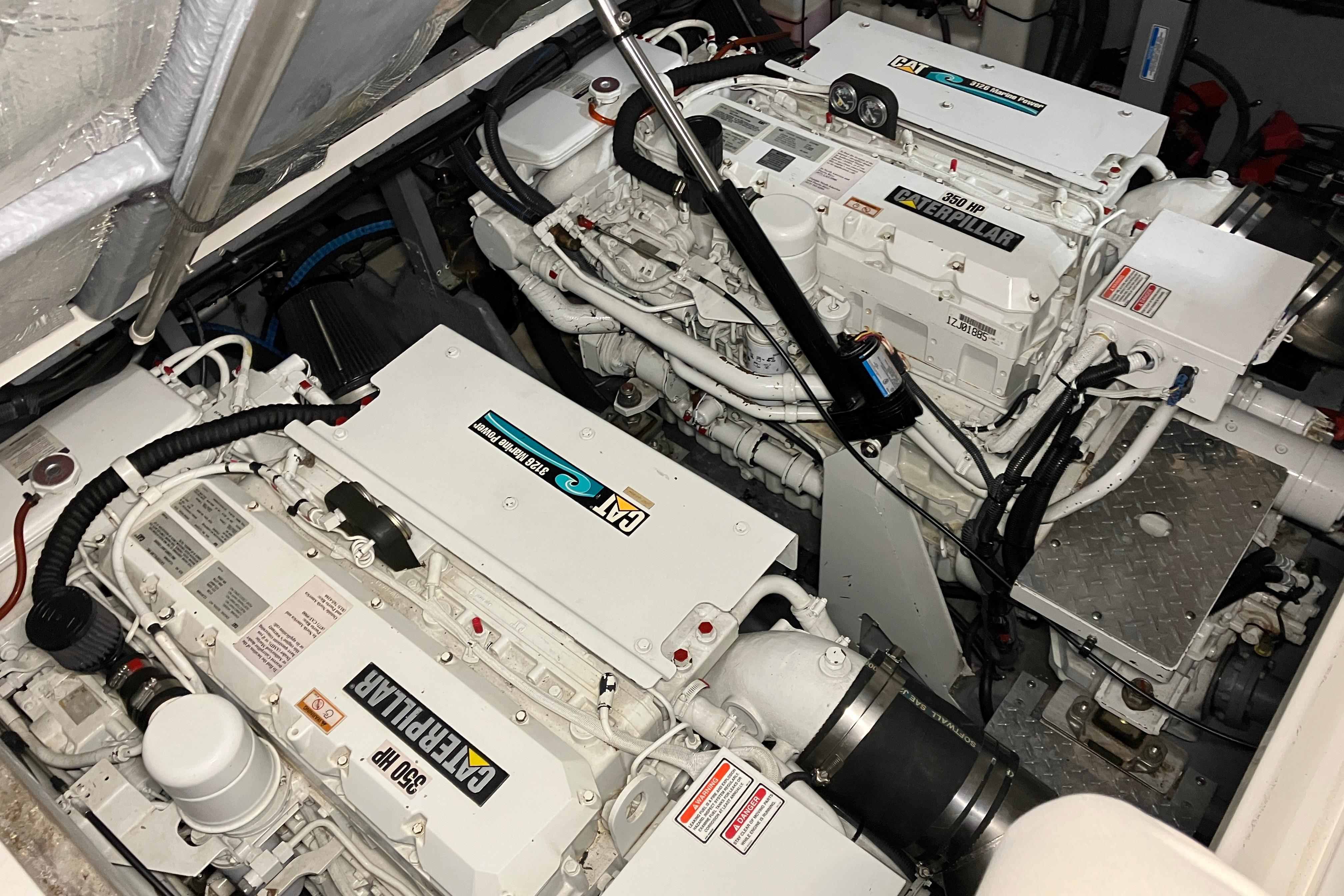 Engine room of 2002 Sea Ray 410 Sundancer with twin Caterpillar engines.
