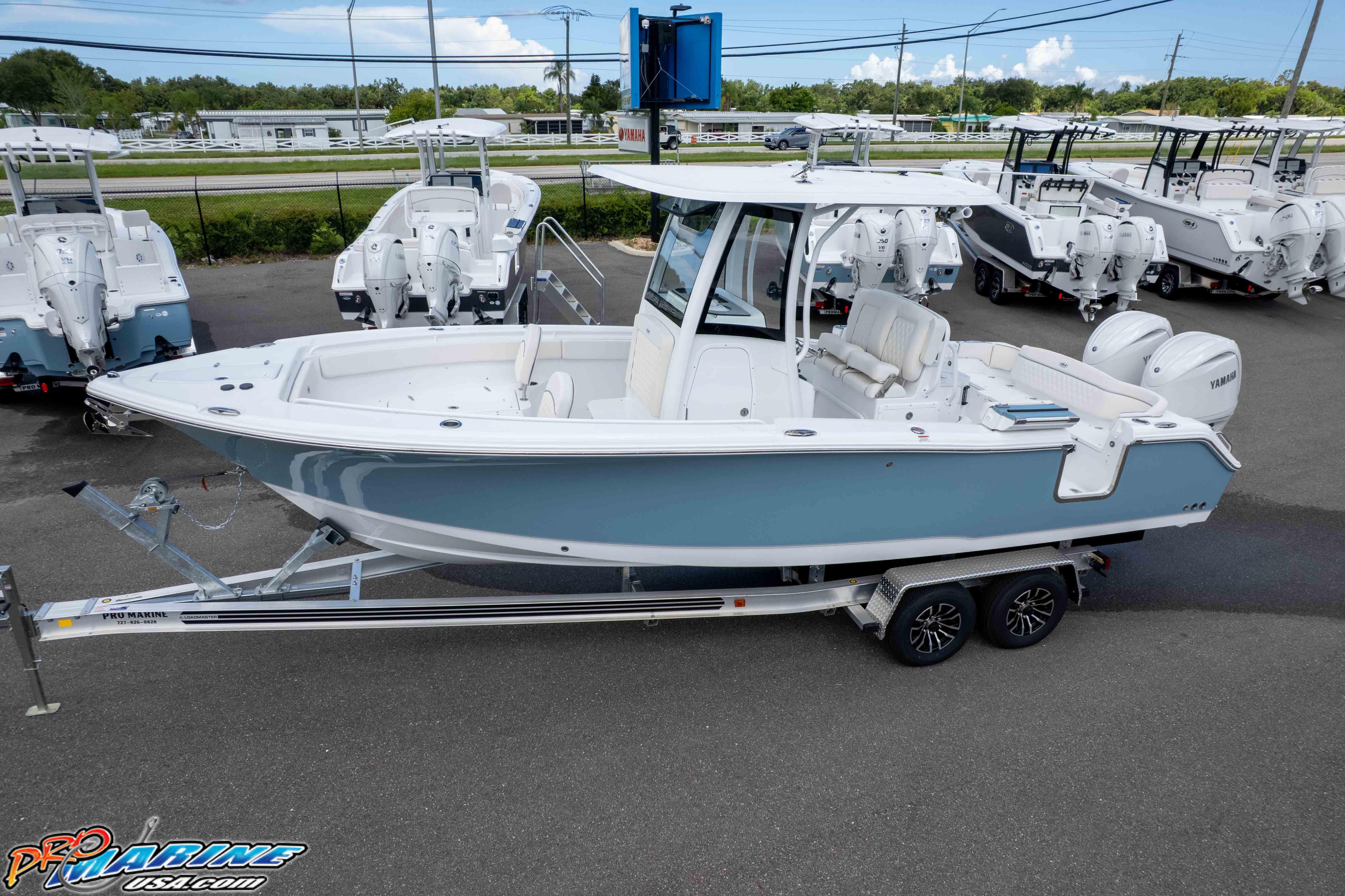 2026 Sea Hunt Ultra 265 SE boat on trailer, displayed at dealership.