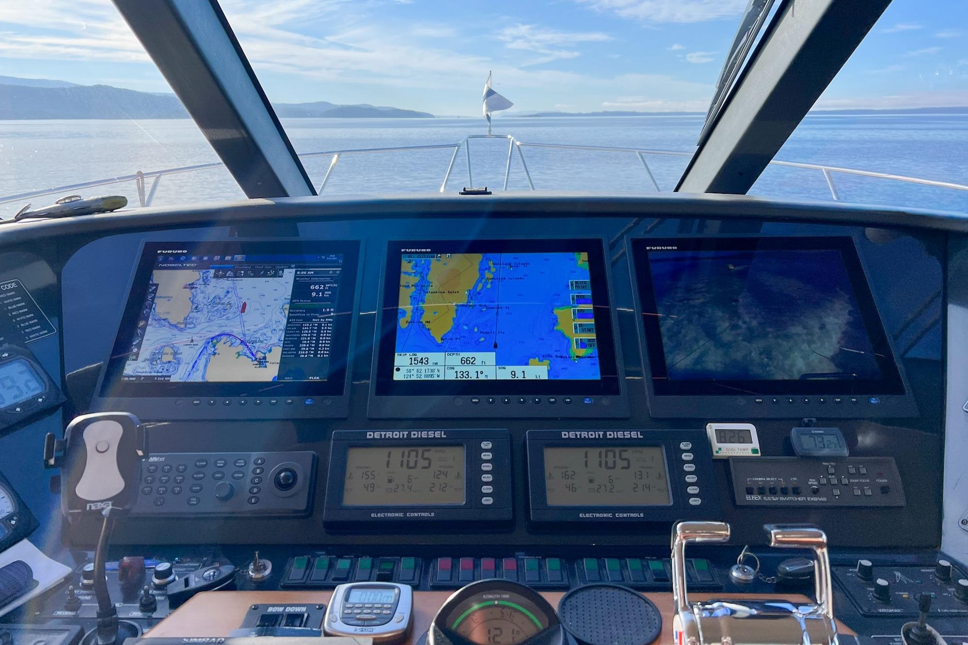 Cockpit view of 2004 West Bay Sonship yacht with navigation screens and controls.