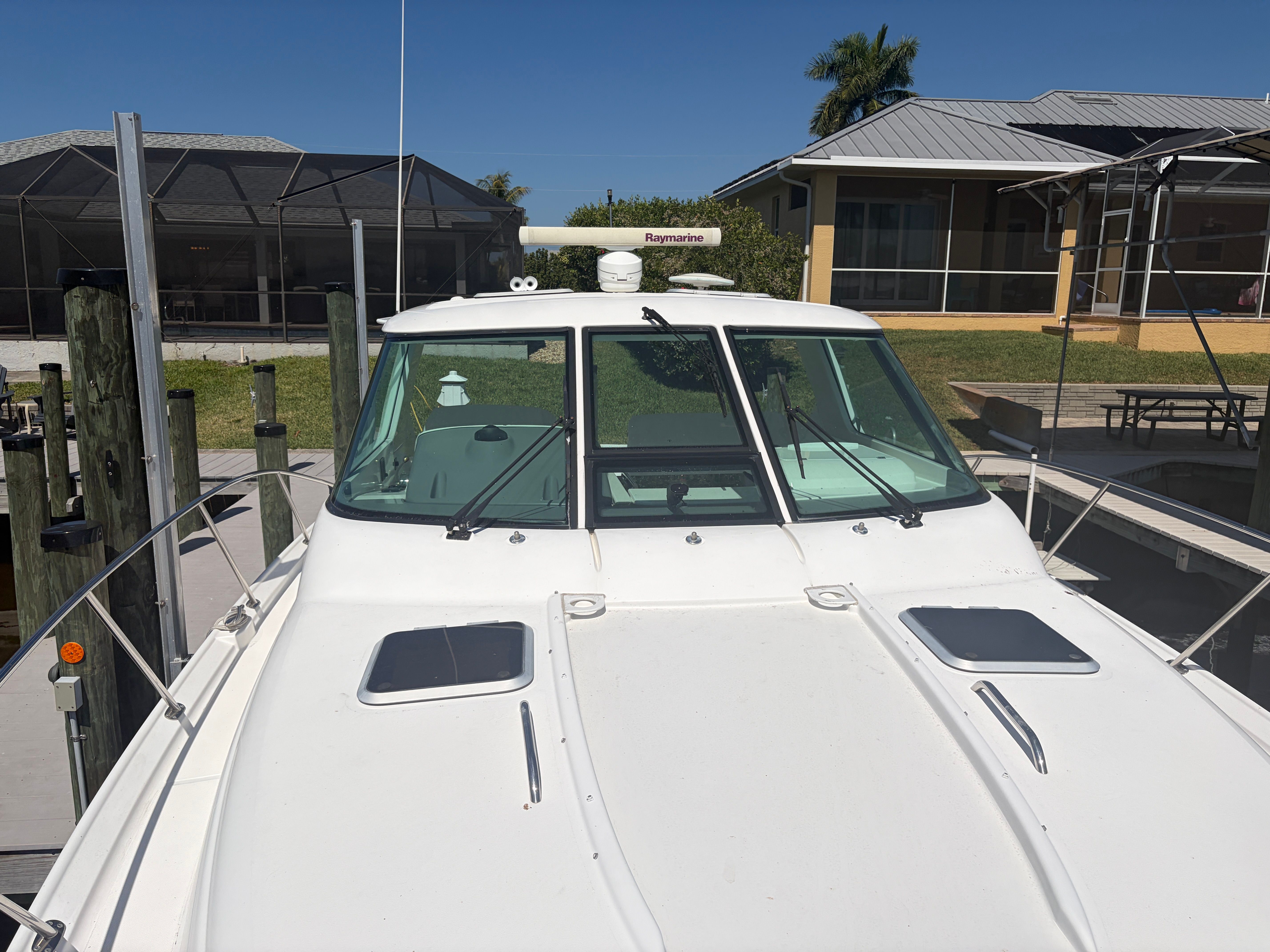 2005 Tiara Yachts Sovran at dock, front view.
