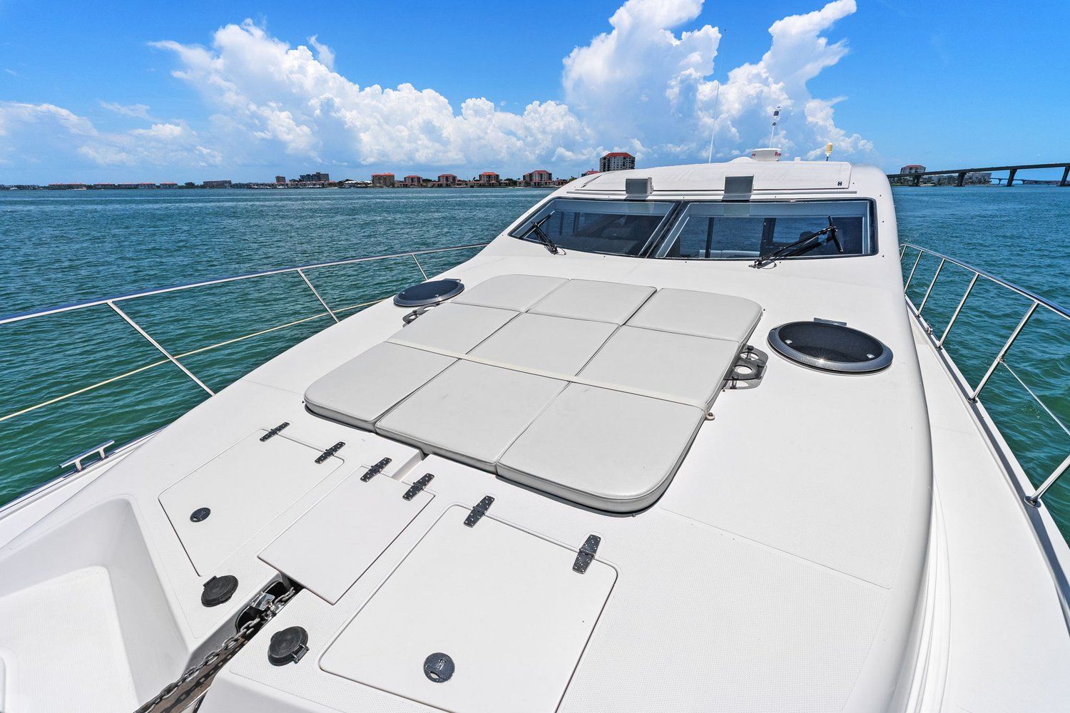 A luxurious catamaran with a spacious deck and panoramic sea views.