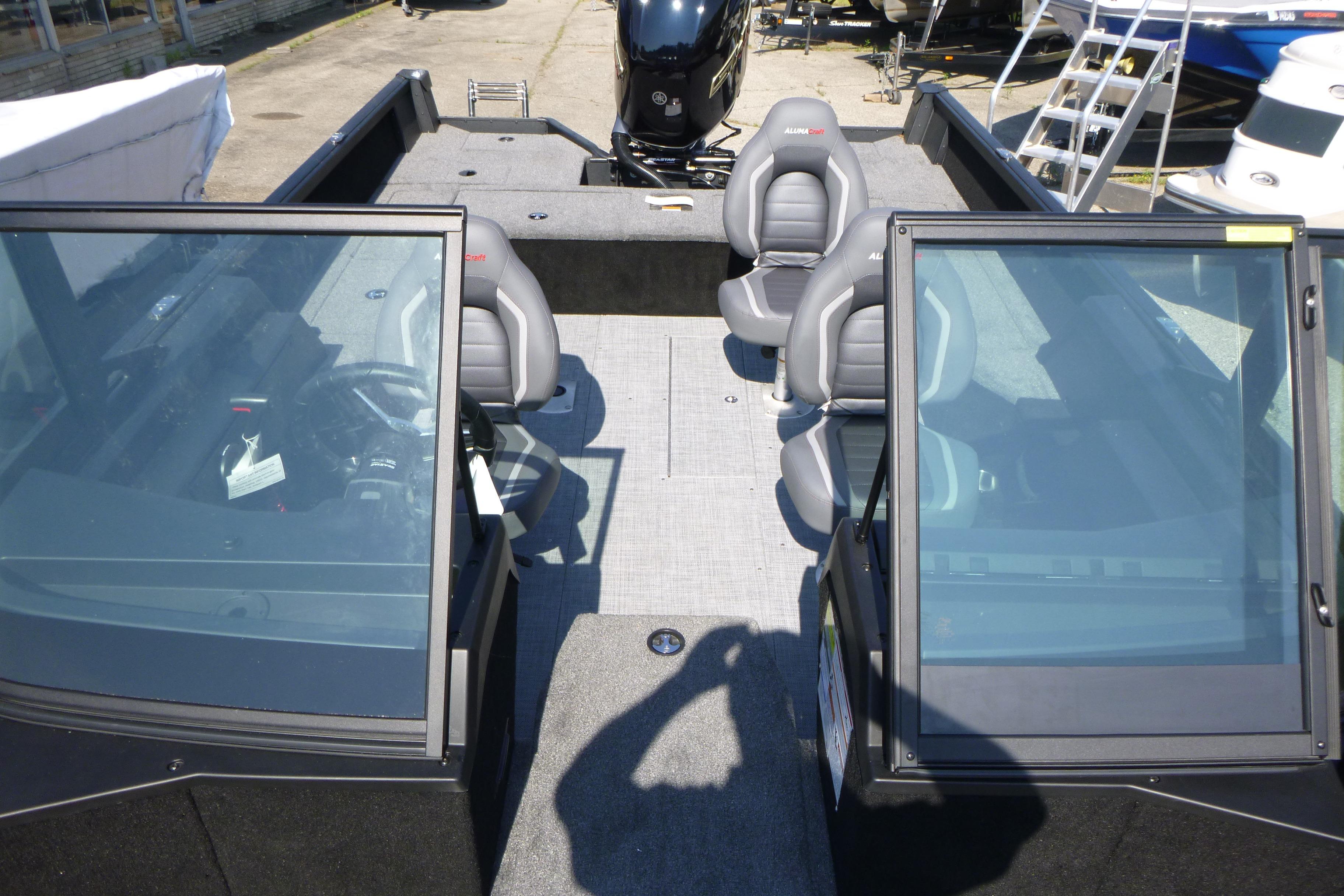 2024 Alumacraft Competitor 185X Sport boat interior with seating and windshield.