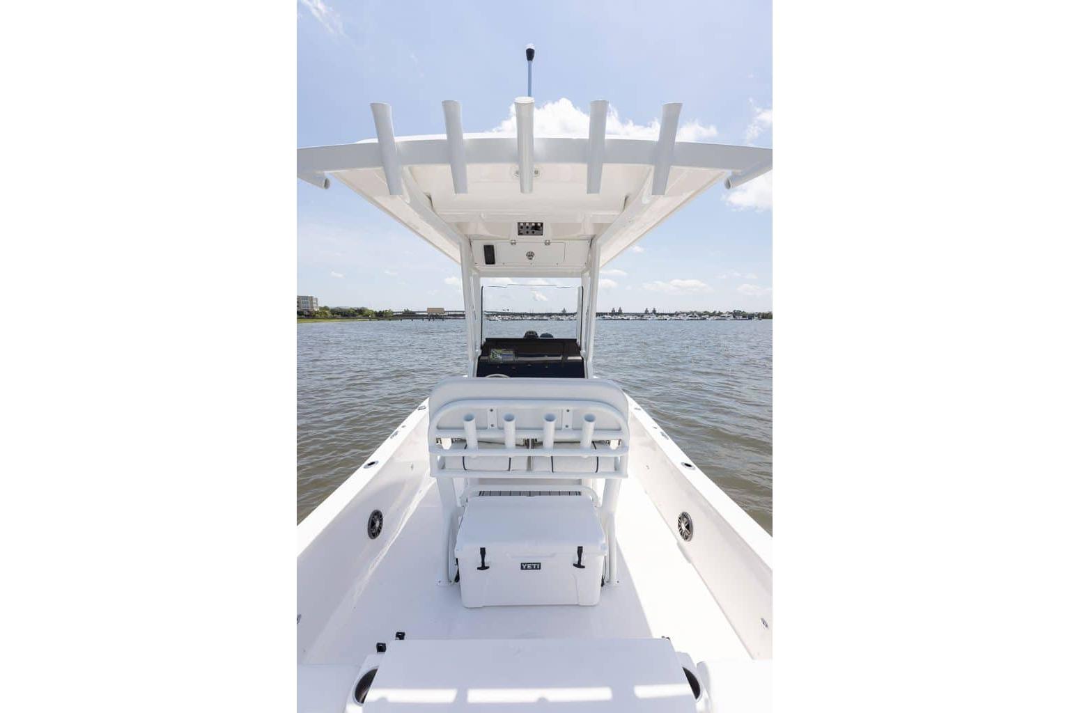 2027 Sea Fox 231 Bay Fox boat on calm water, featuring a sleek white interior.