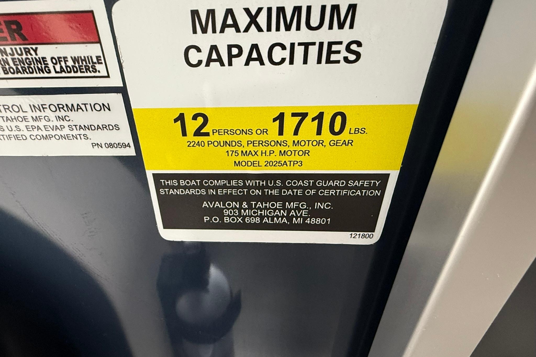 2026 Avalon LSZ Elite boat capacity label, 12 persons or 1710 lbs, US Coast Guard compliant.