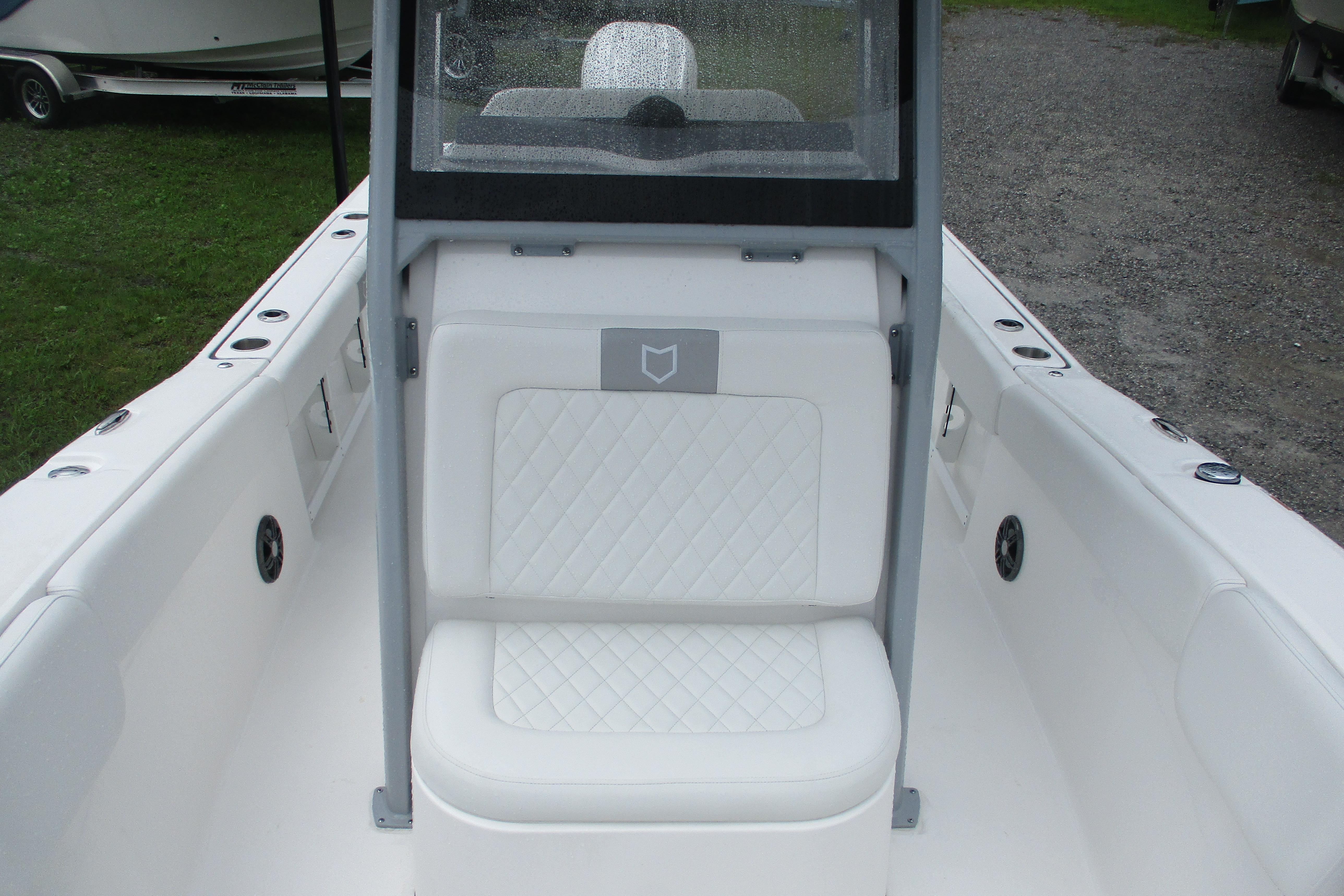 2026 Sea Fox 248 Commander boat interior with white cushioned seating.