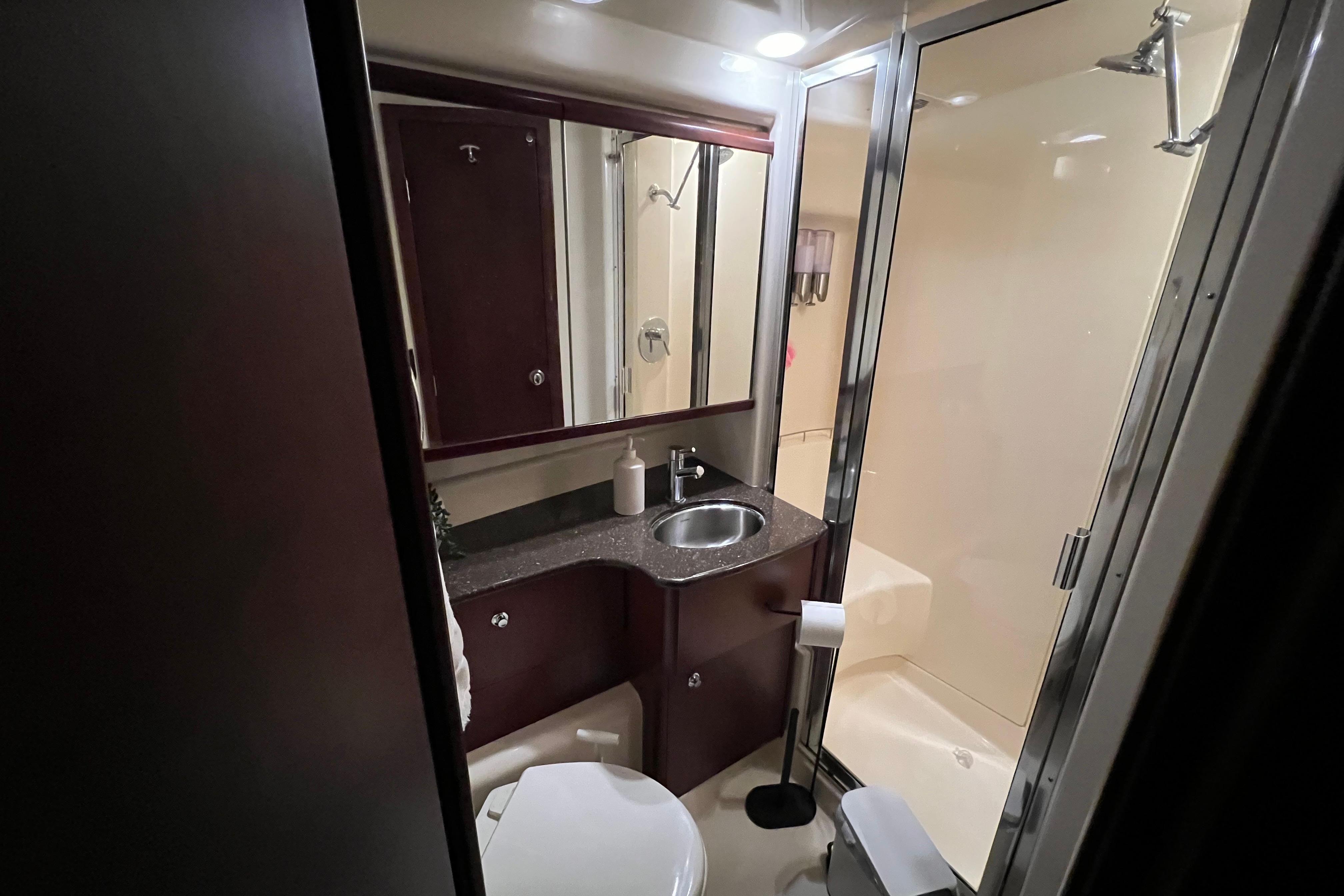Luxurious bathroom in 2012 Meridian 341 Sedan yacht with modern fixtures and shower.