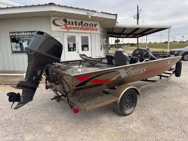 2001 Xpress X51 boat on trailer outside Outdoor Specialties store.