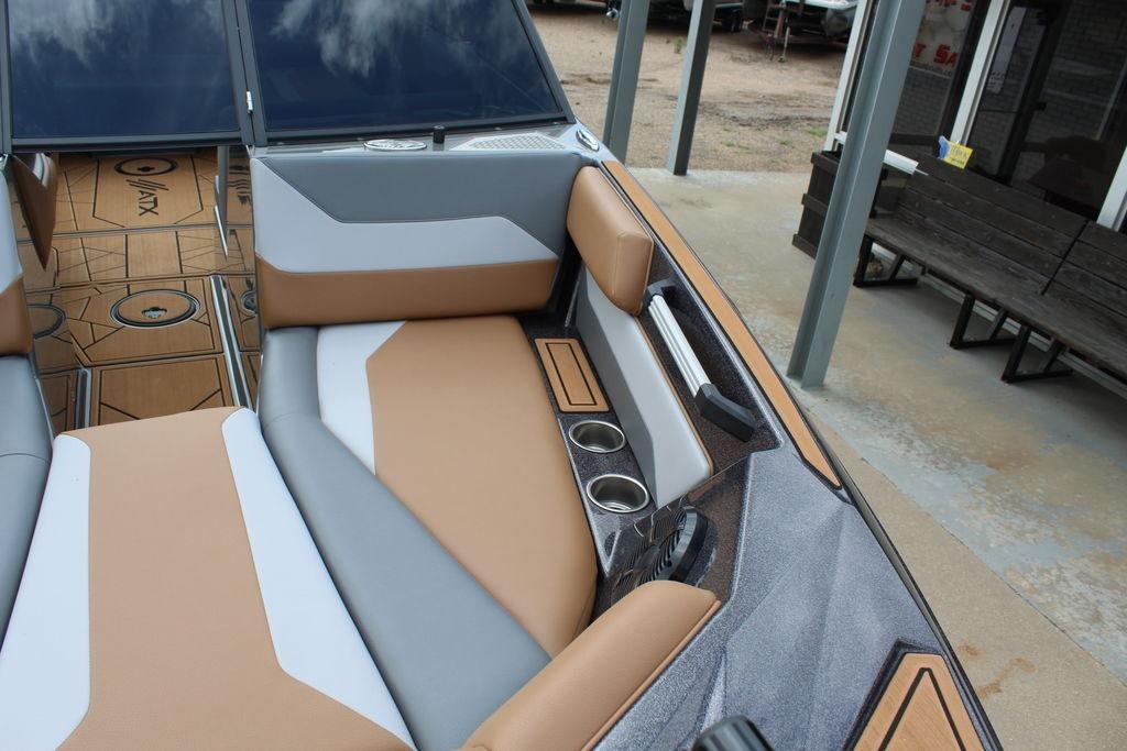 2024 ATX Surf Boats 22 Type-S interior with tan and gray seating, cup holders, and sleek design.