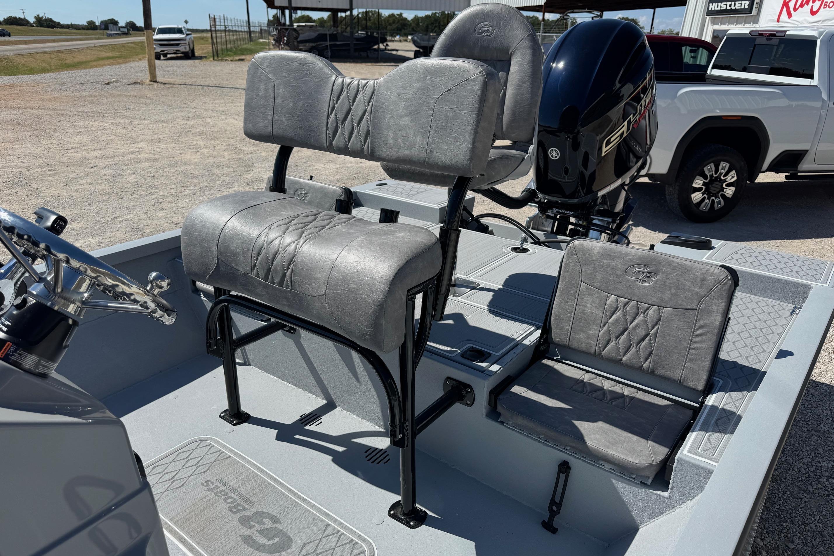2026 G3 21GX boat interior with gray seating and steering wheel.