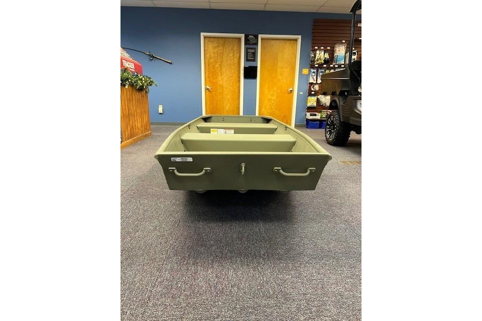 2026 Tracker Grizzly 12 Jon boat displayed indoors, showcasing its sturdy design.