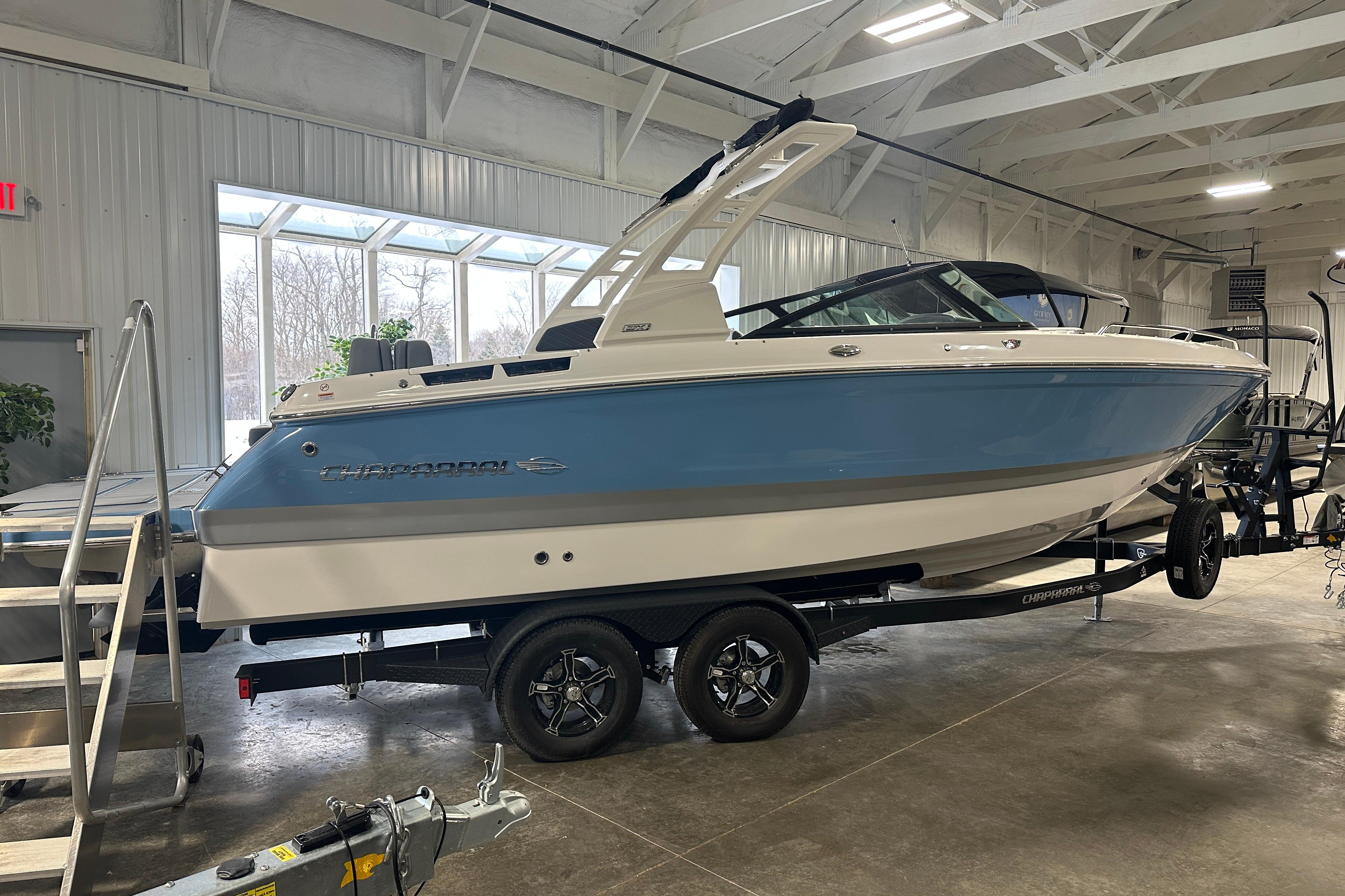 2026 Chaparral SSX 6 boat indoors on a trailer.