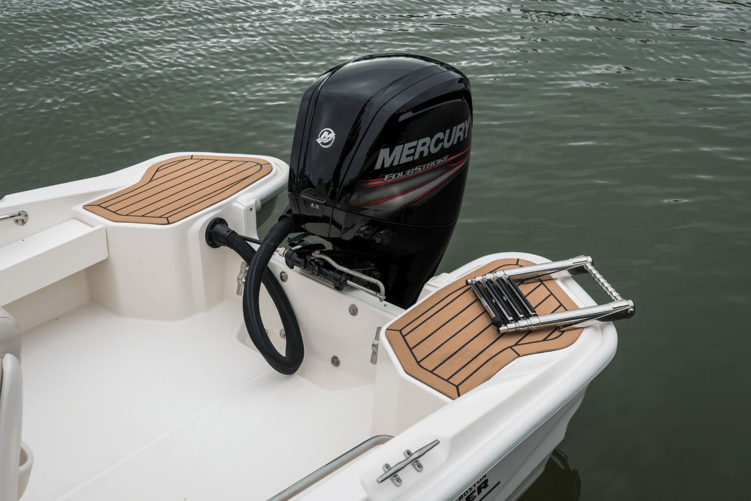 The image shows the stern of a Boston Whaler 160 Super Sport with a Mercury engine.