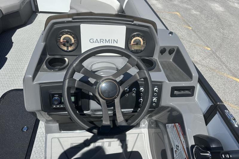 Steering console of 2026 Evotti 523QL boat with Garmin navigation system.
