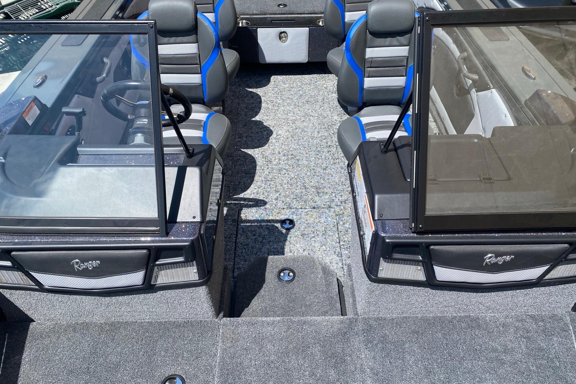 2026 Ranger VX1888 WT boat interior with dual consoles and blue-accented seating.
