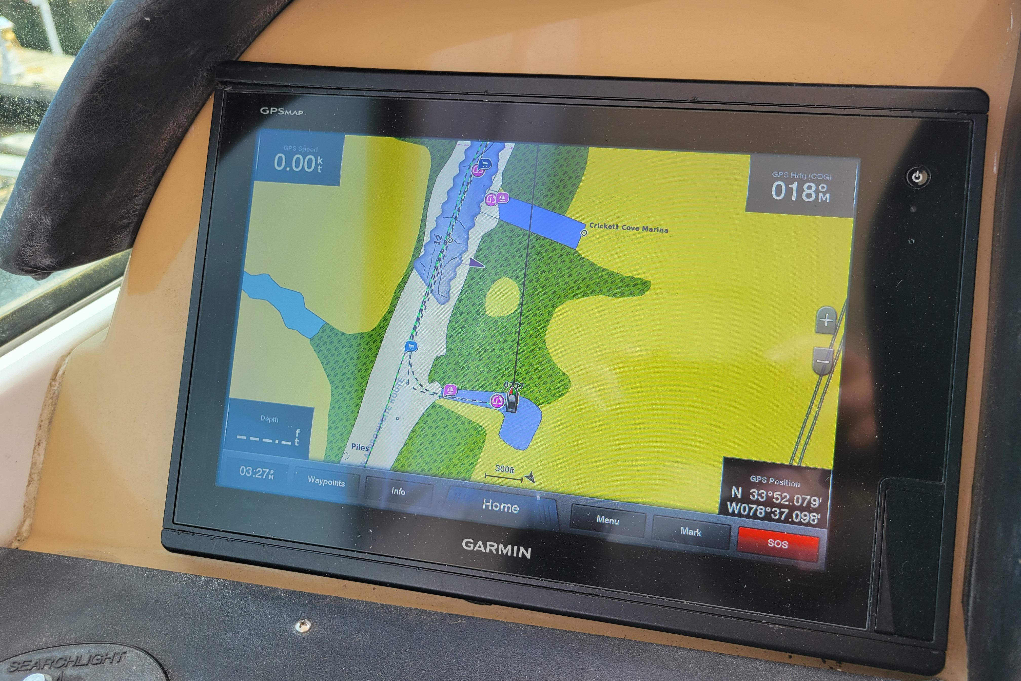 Garmin GPS display on 2001 Carver 570 Voyager Pilothouse, showing nautical map and coordinates.