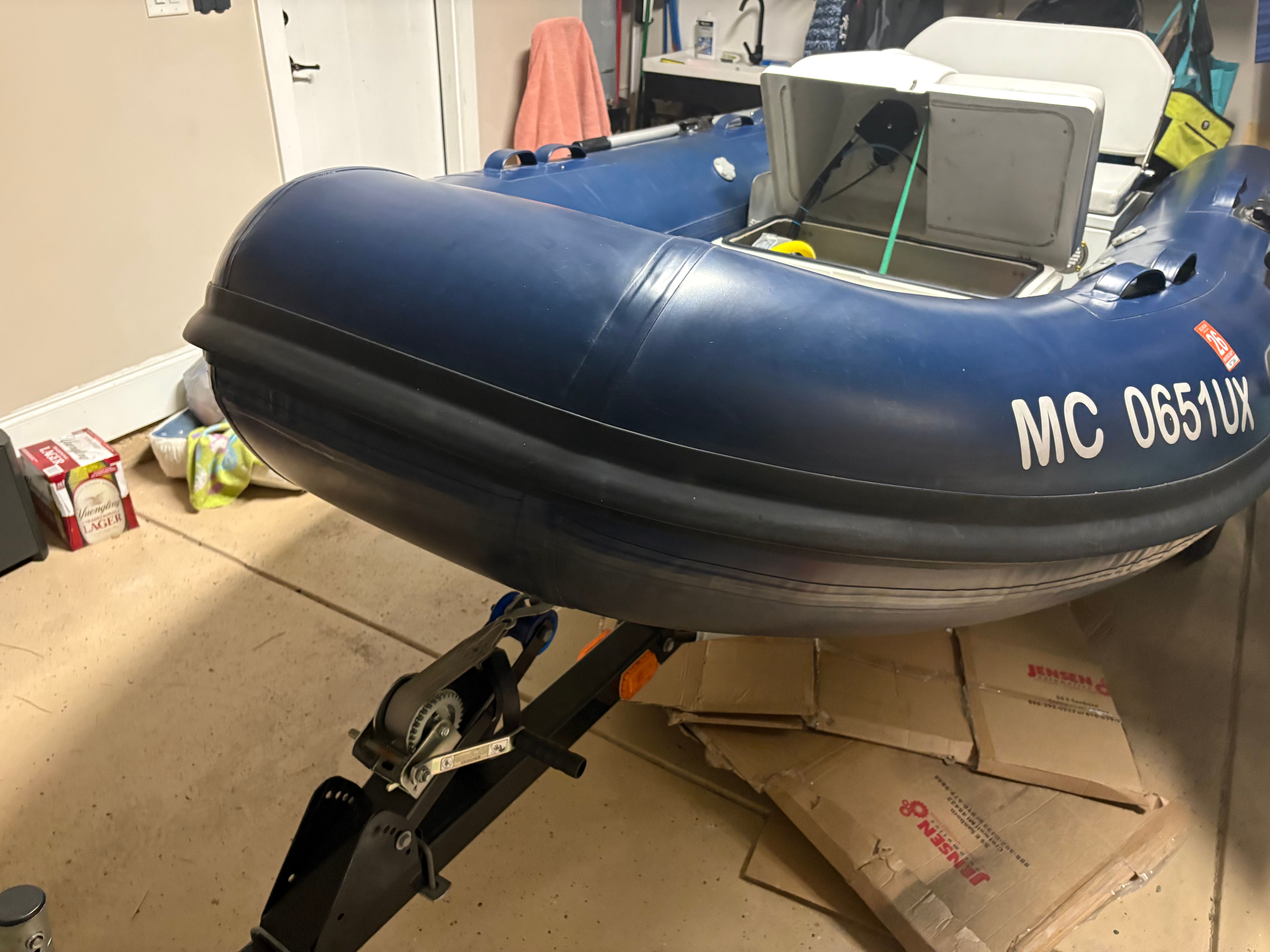 Lianya HPC330 inflatable boat from 2022 in a garage.