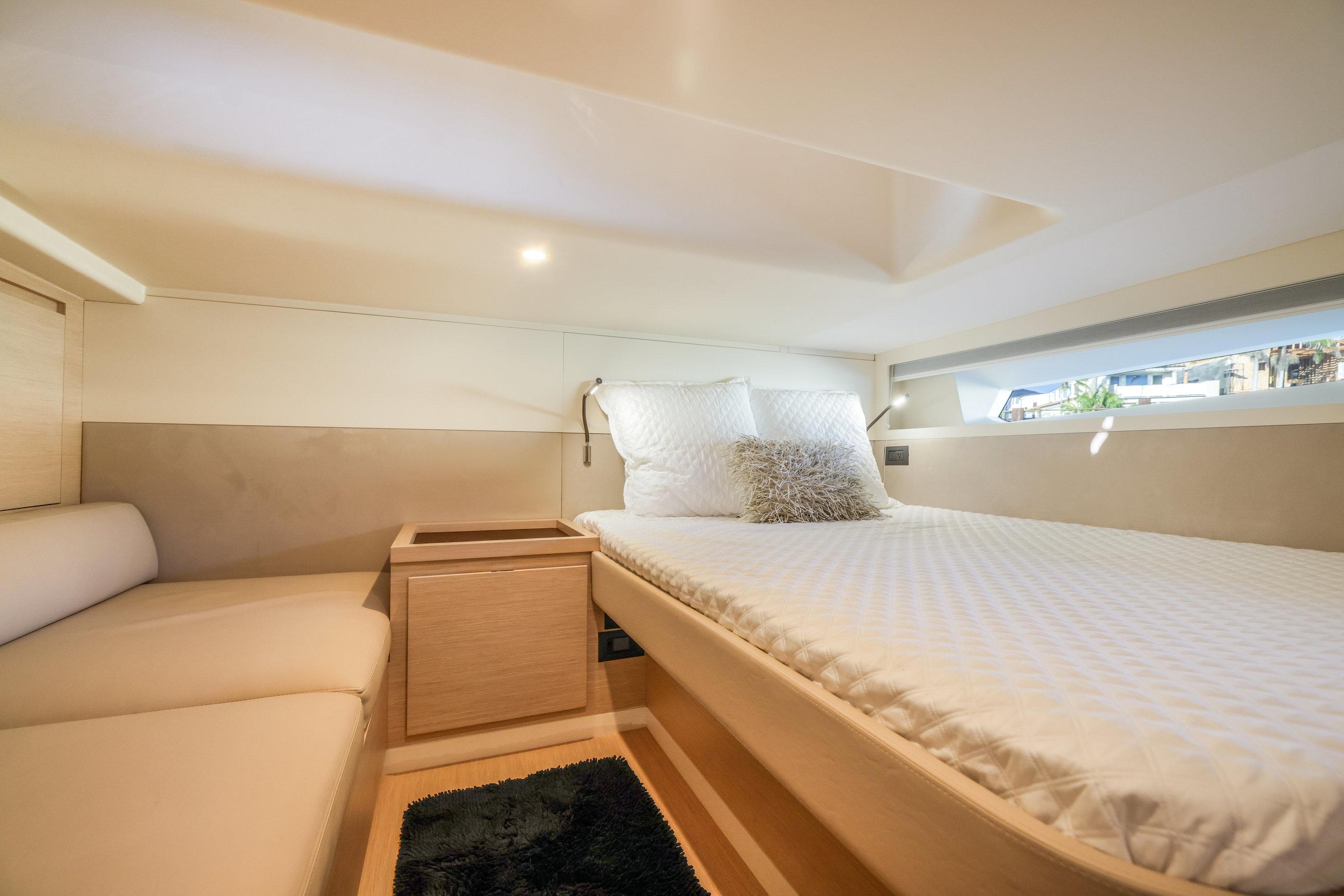 Luxurious cabin interior of 2022 Solaris Power yacht, featuring a comfortable bed and modern design.