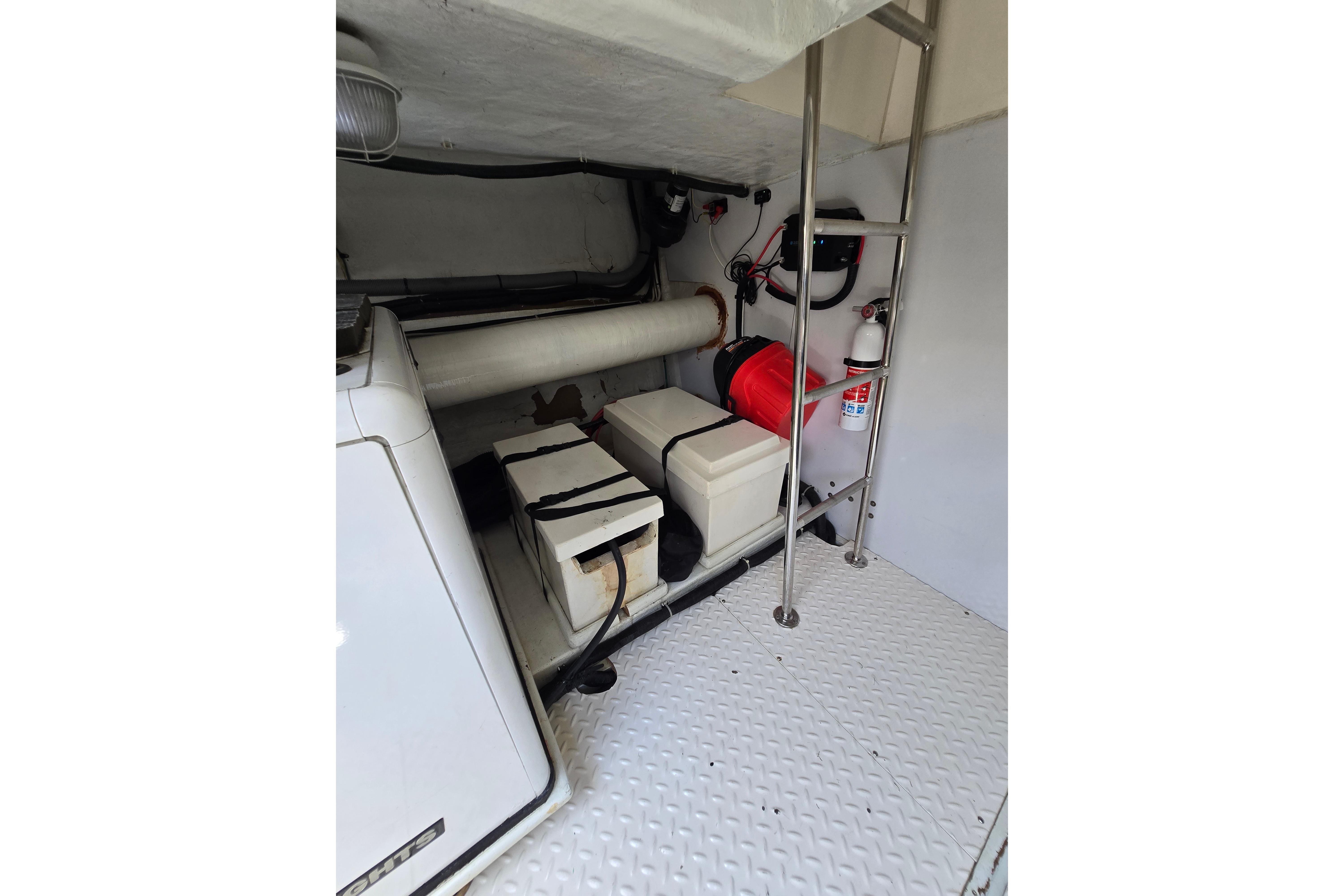Engine room of 2004 Grand Harbour 58 yacht with equipment and safety features.