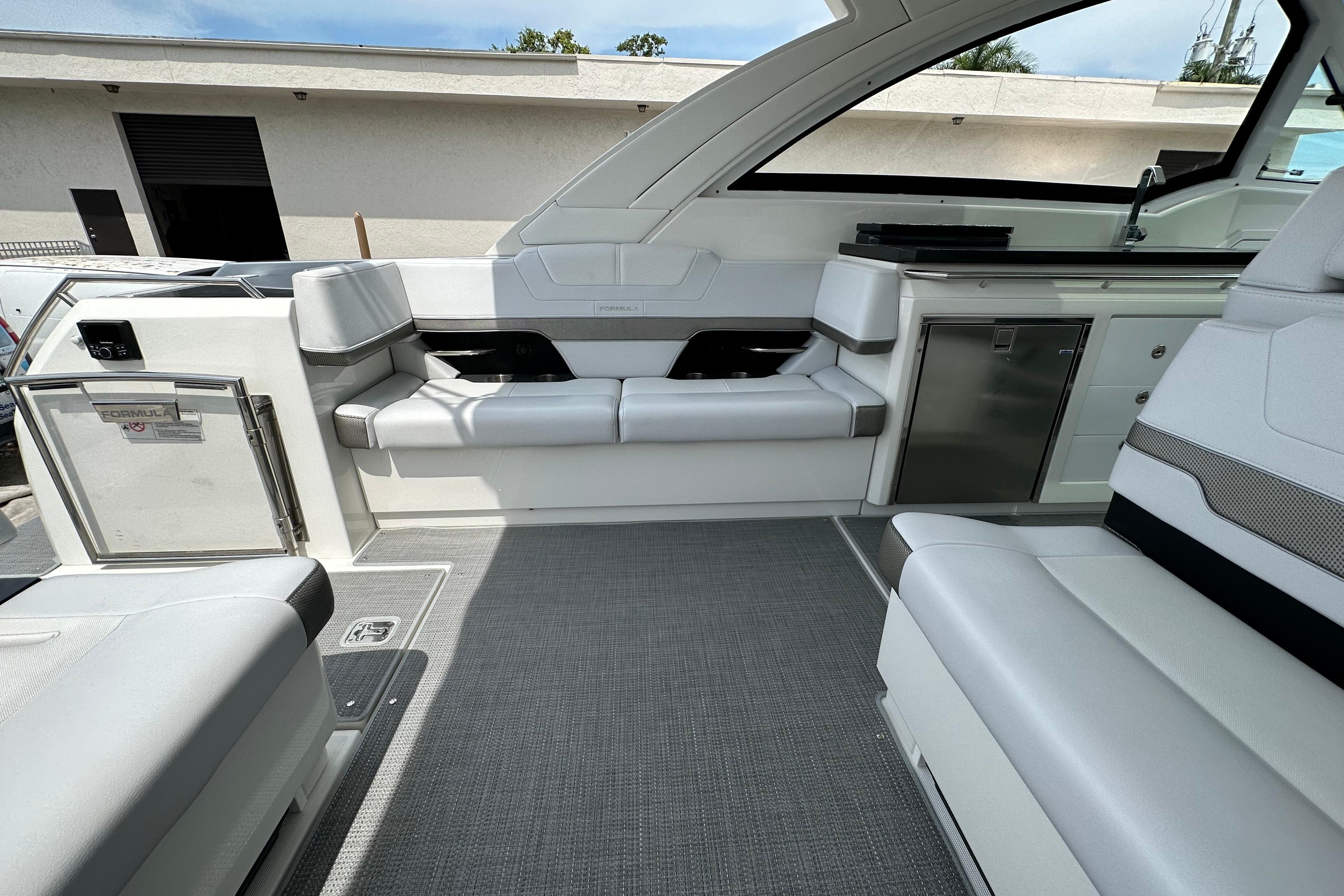 Interior of 2021 Formula 380 Super Sport Crossover OB, featuring sleek seating and modern amenities.