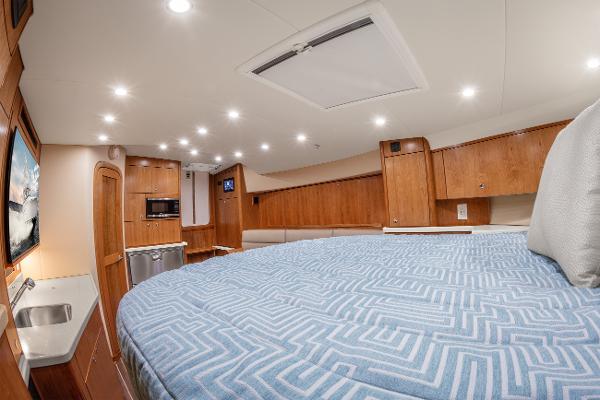Luxurious interior of 2025 Albemarle 36 Express yacht with modern amenities and cozy bedding.