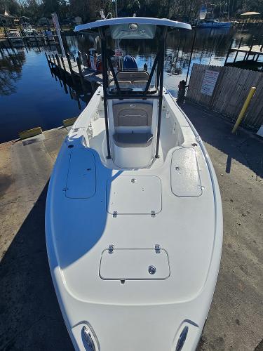 2026 Sea Hunt BX 22 BR boat docked by a serene waterfront.
