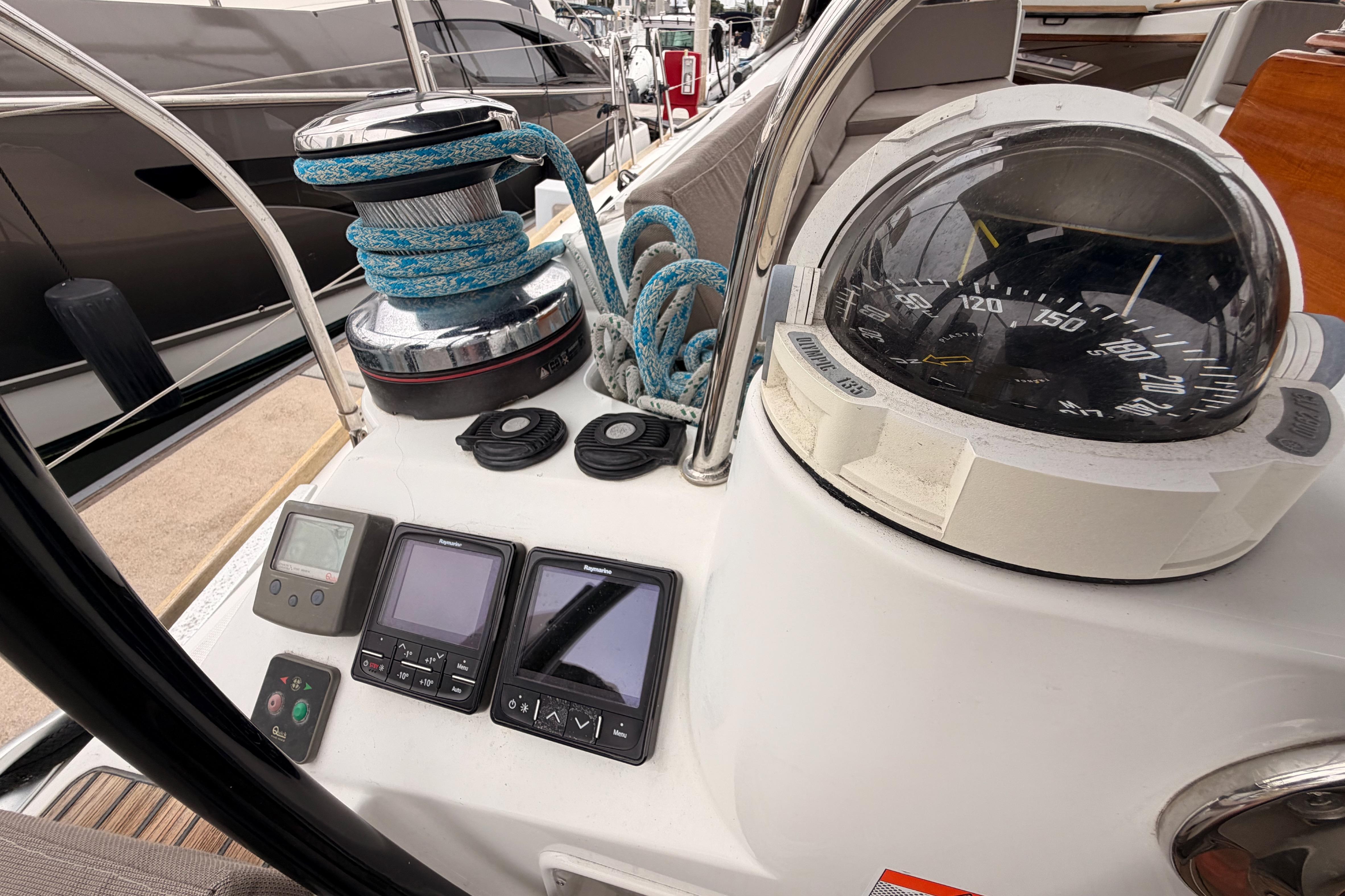 Cockpit of 2014 Jeanneau Sun Odyssey 50 DS with navigation instruments and compass.