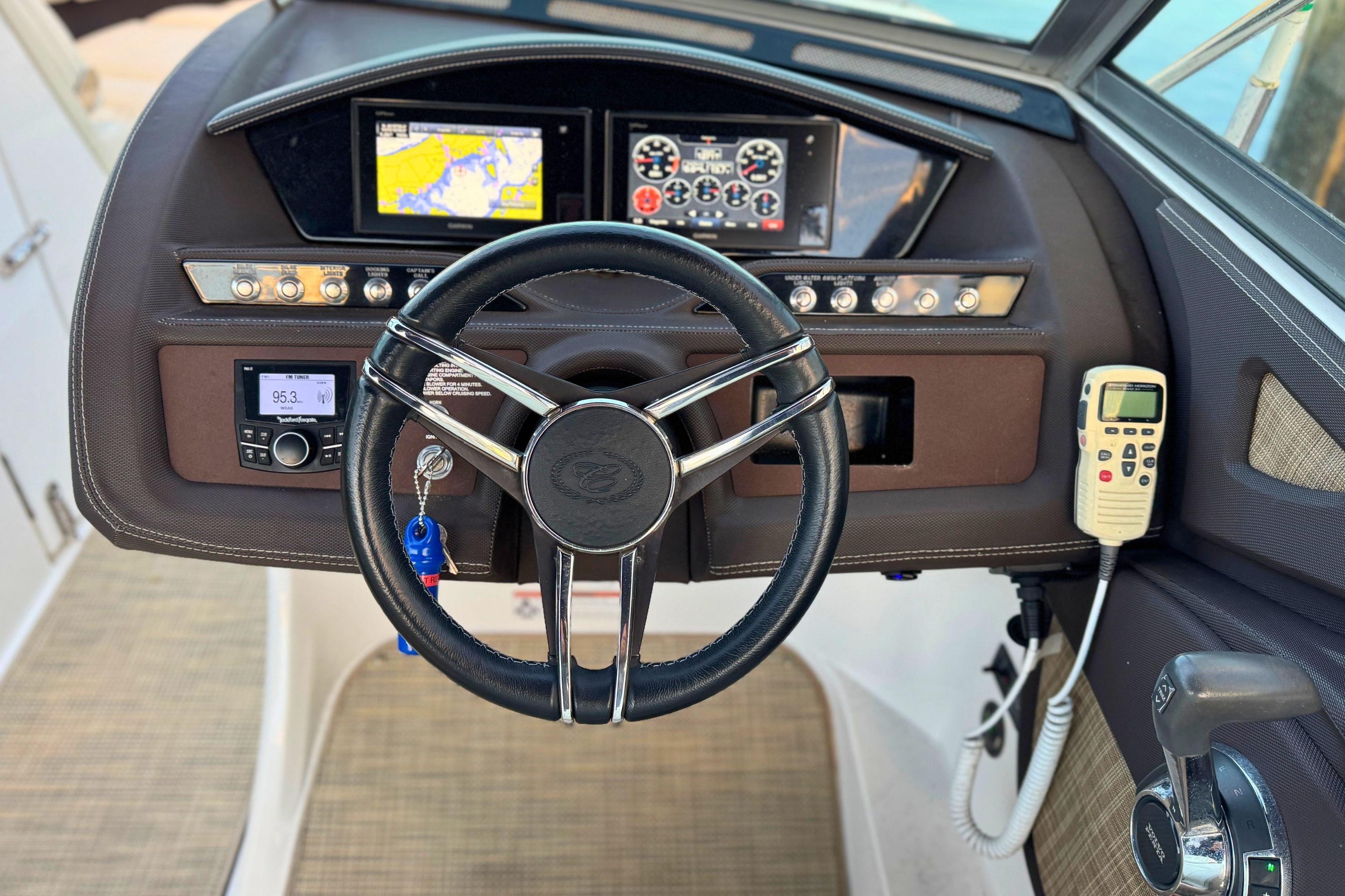 2019 Cobalt R3 boat dashboard with steering wheel, navigation screens, and control panel.