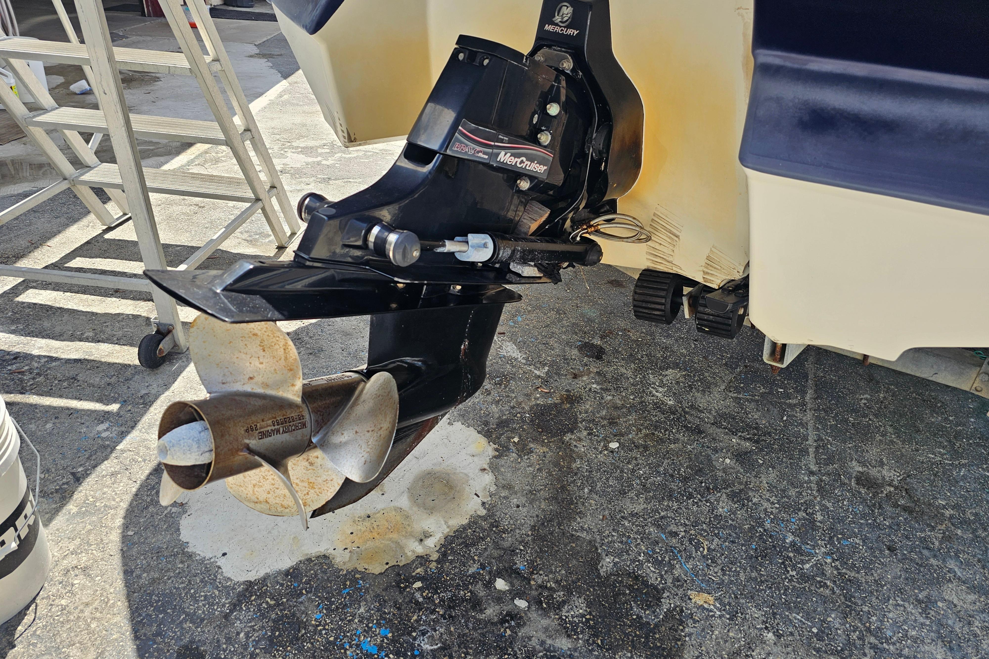 Outboard motor of a 2008 Monterey 220 Explorer boat on a concrete surface.