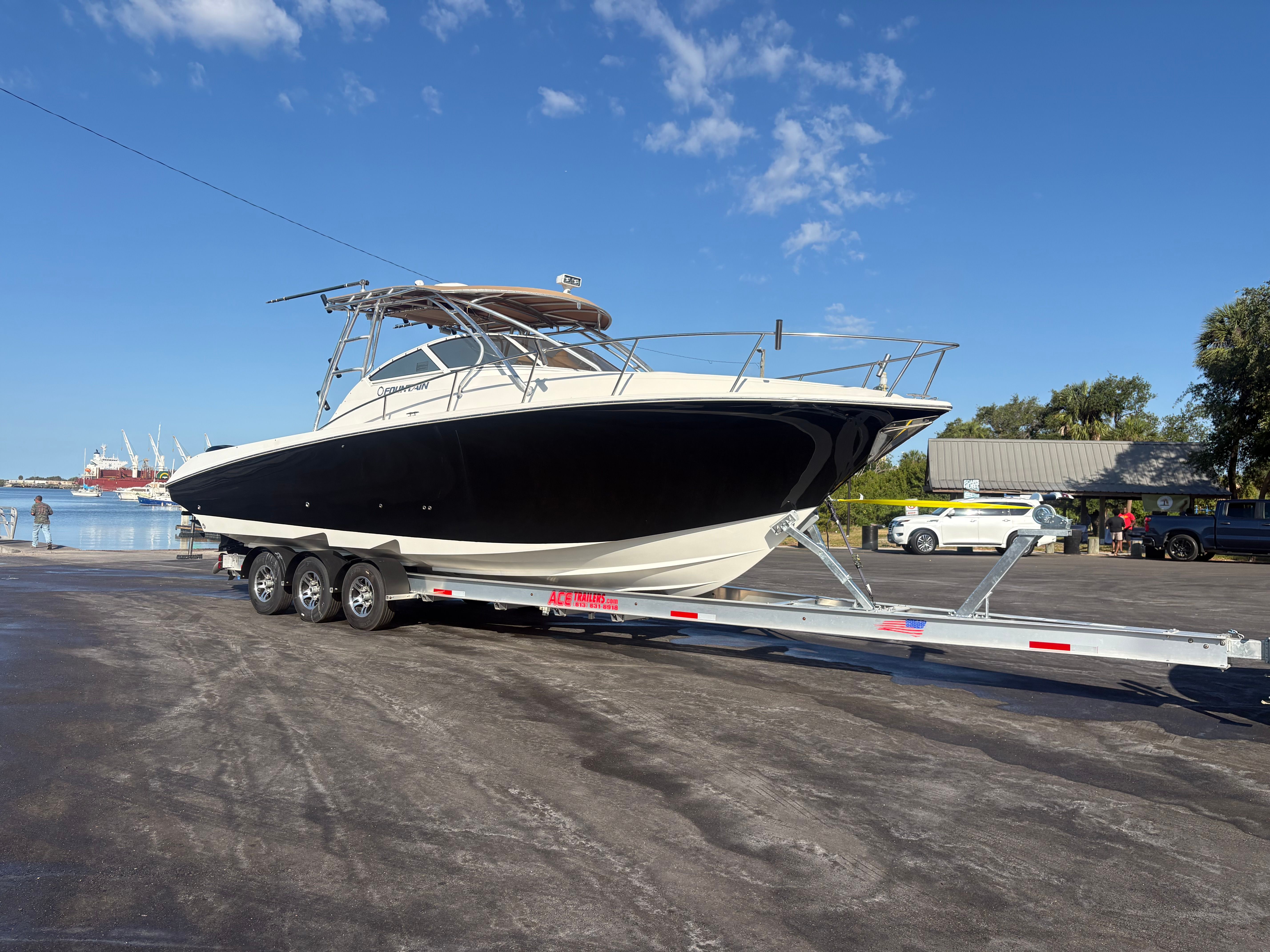 2009 Fountain 33 Sportfish Cruiser on trailer at harbor.
