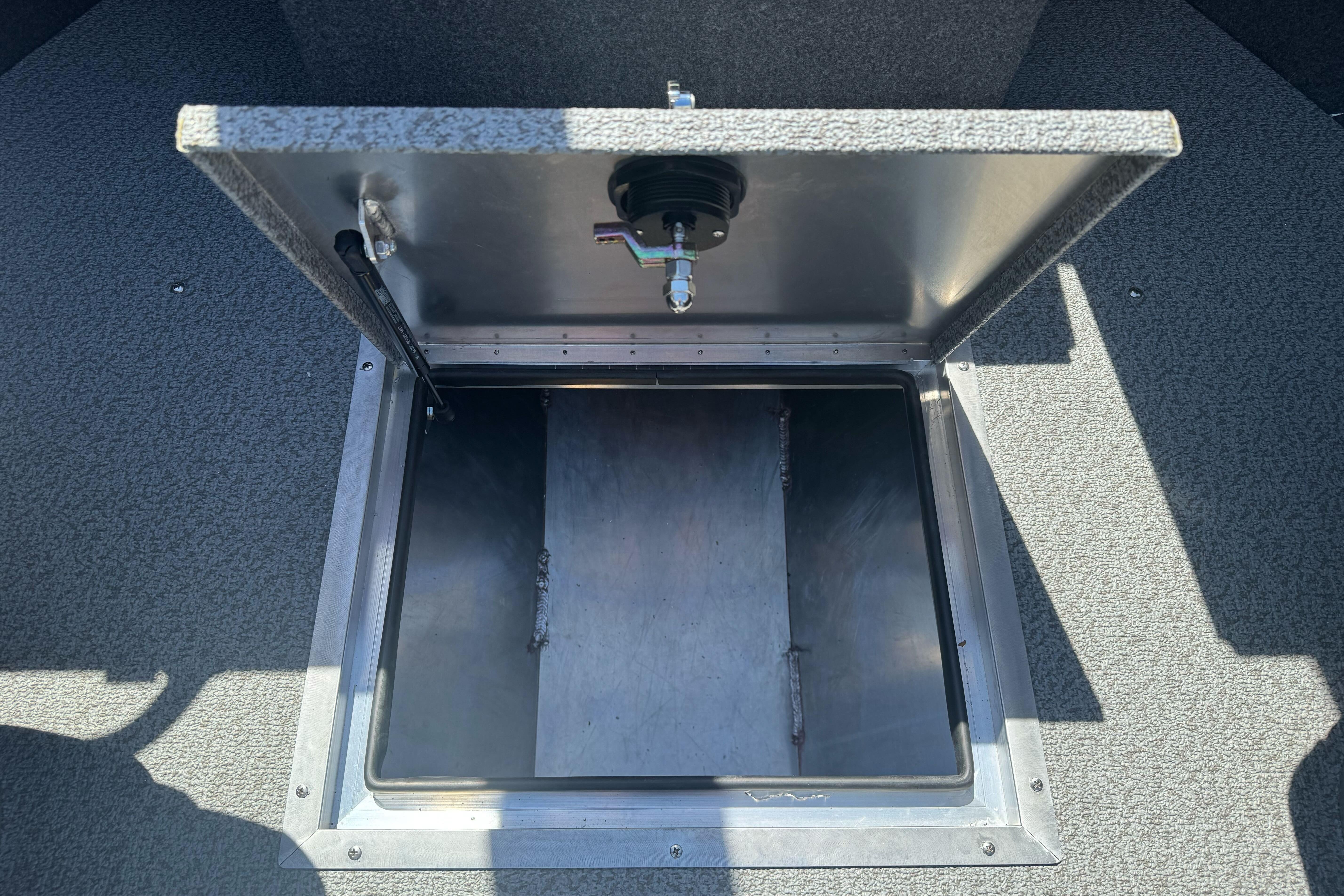 Open storage compartment in 2026 Lund 210 Heavy Gauge boat.