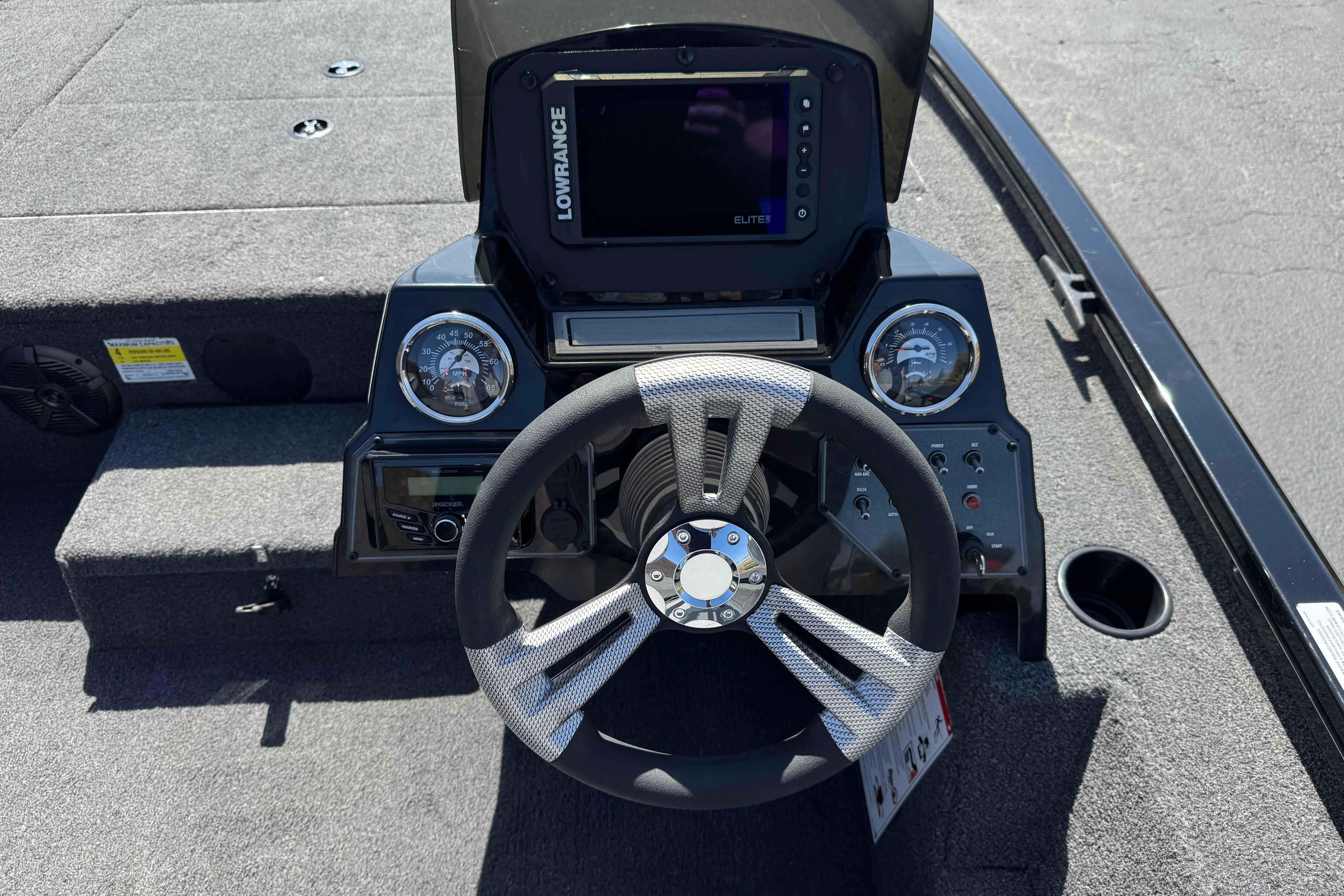 2024 Lowe Stinger 175 boat dashboard with steering wheel and Lowrance Elite display.
