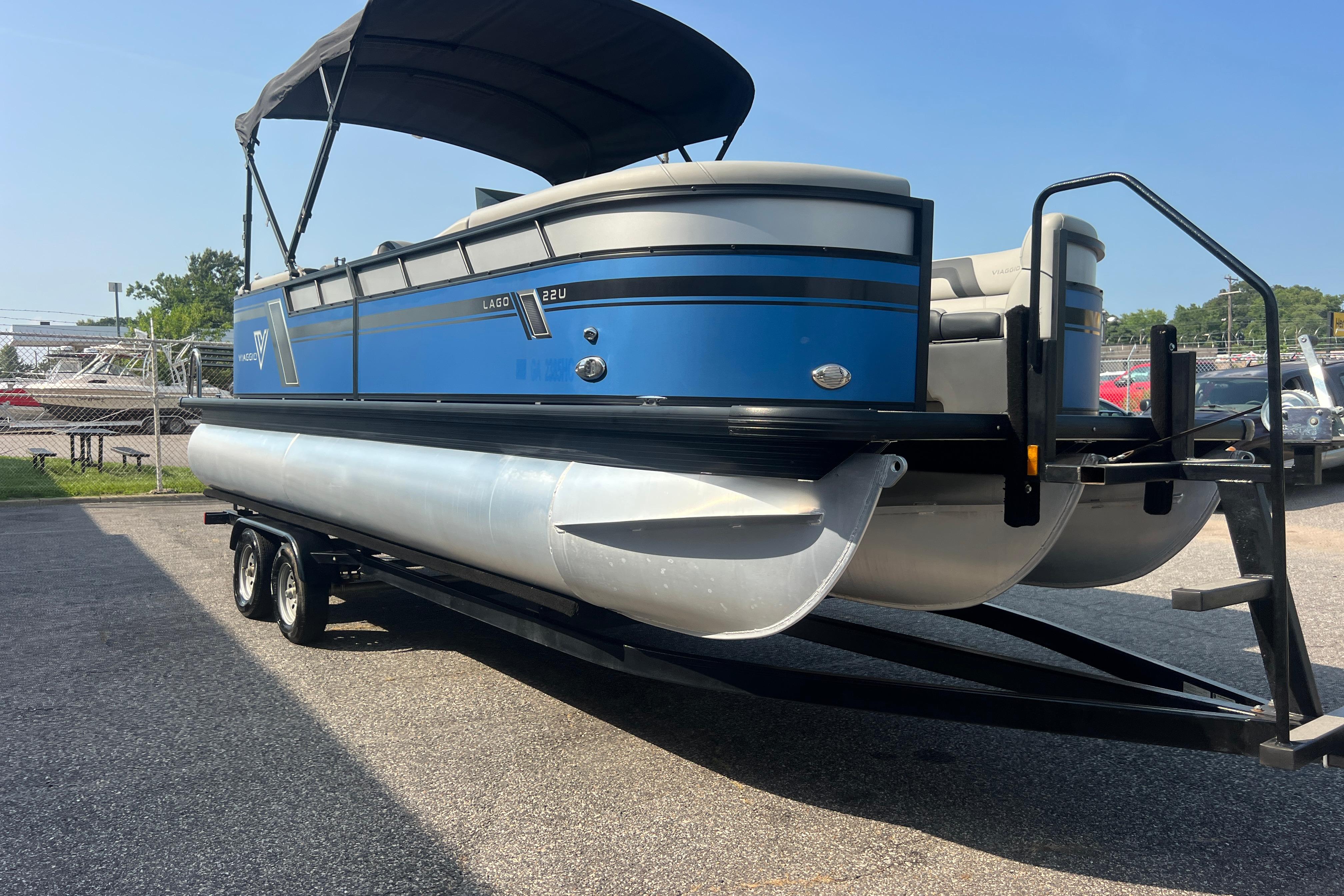 2022 Viaggio Lago V-U 22 pontoon boat on trailer, blue and silver design.