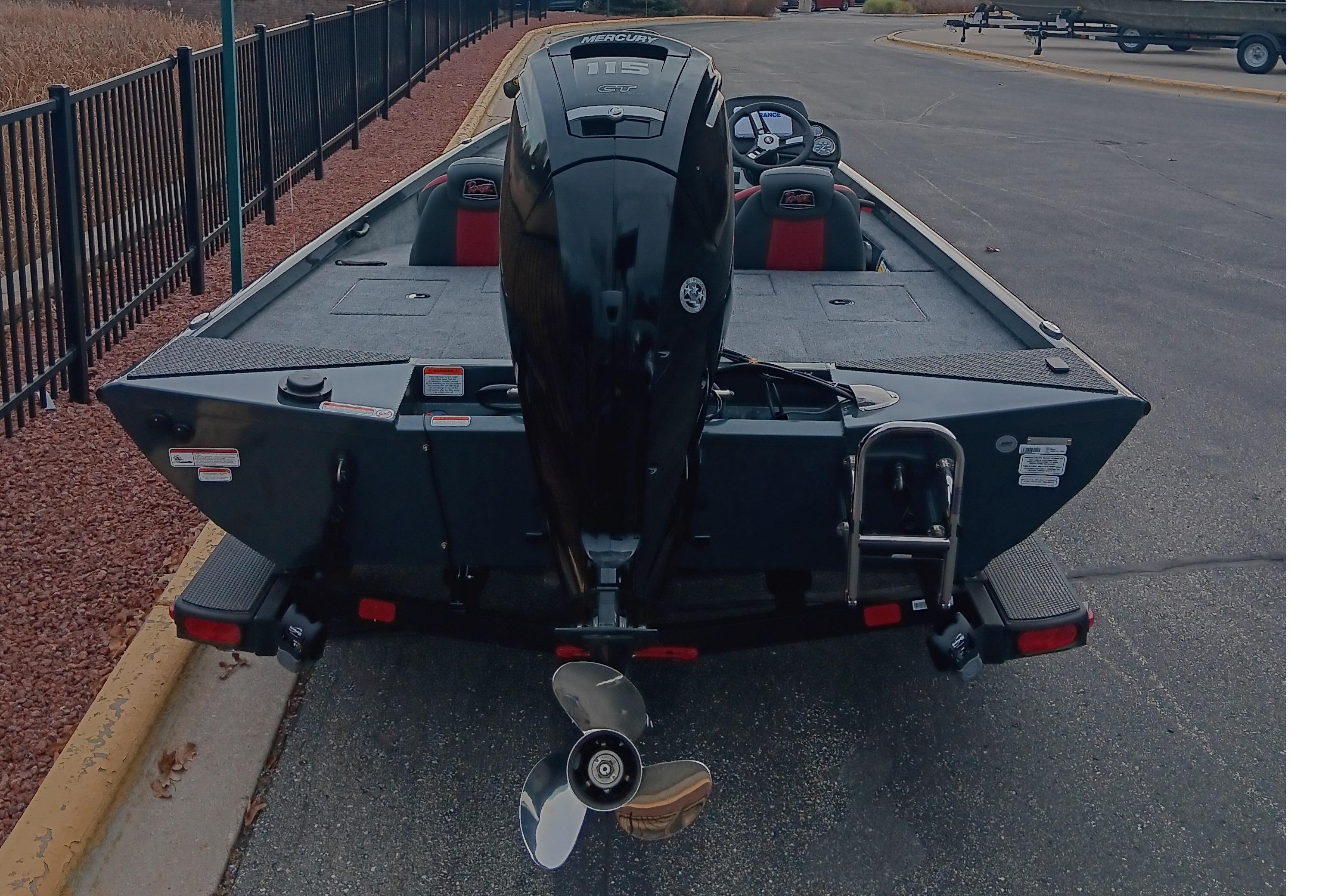 2026 Ranger RT188 boat with Mercury outboard motor, parked on pavement.