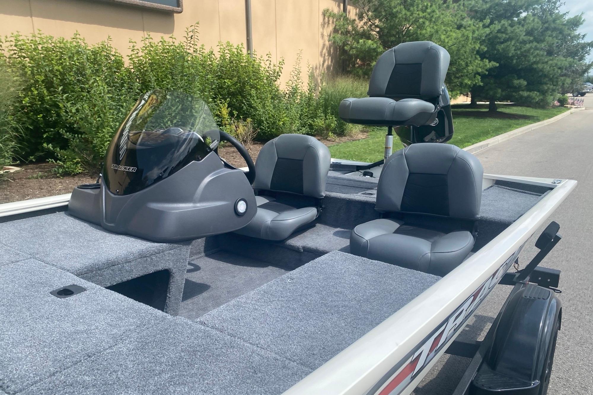 2026 Tracker Pro 170 boat with seating, parked outdoors on a sunny day.
