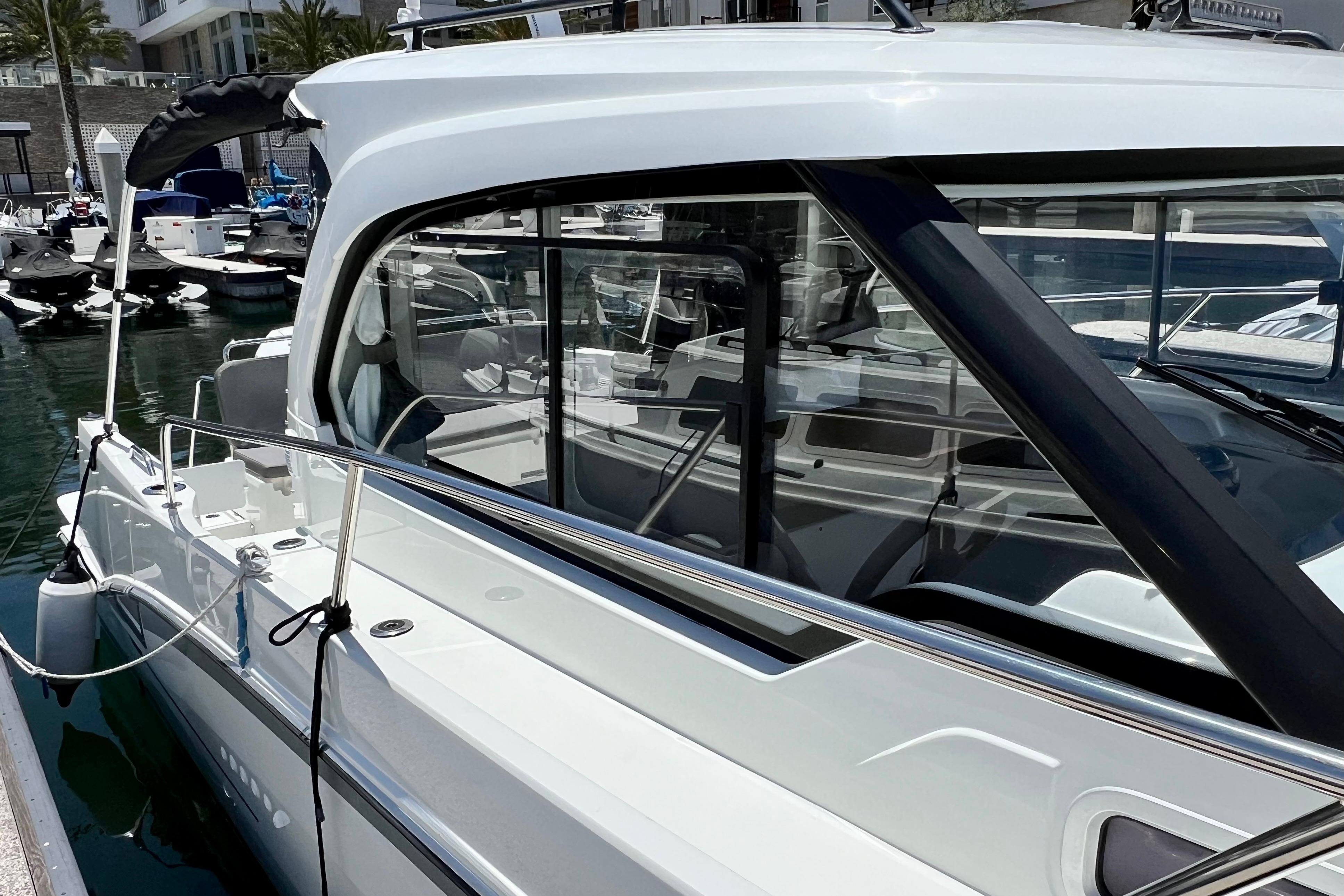 2023 Beneteau Antares 8 docked, showcasing sleek design and modern features.