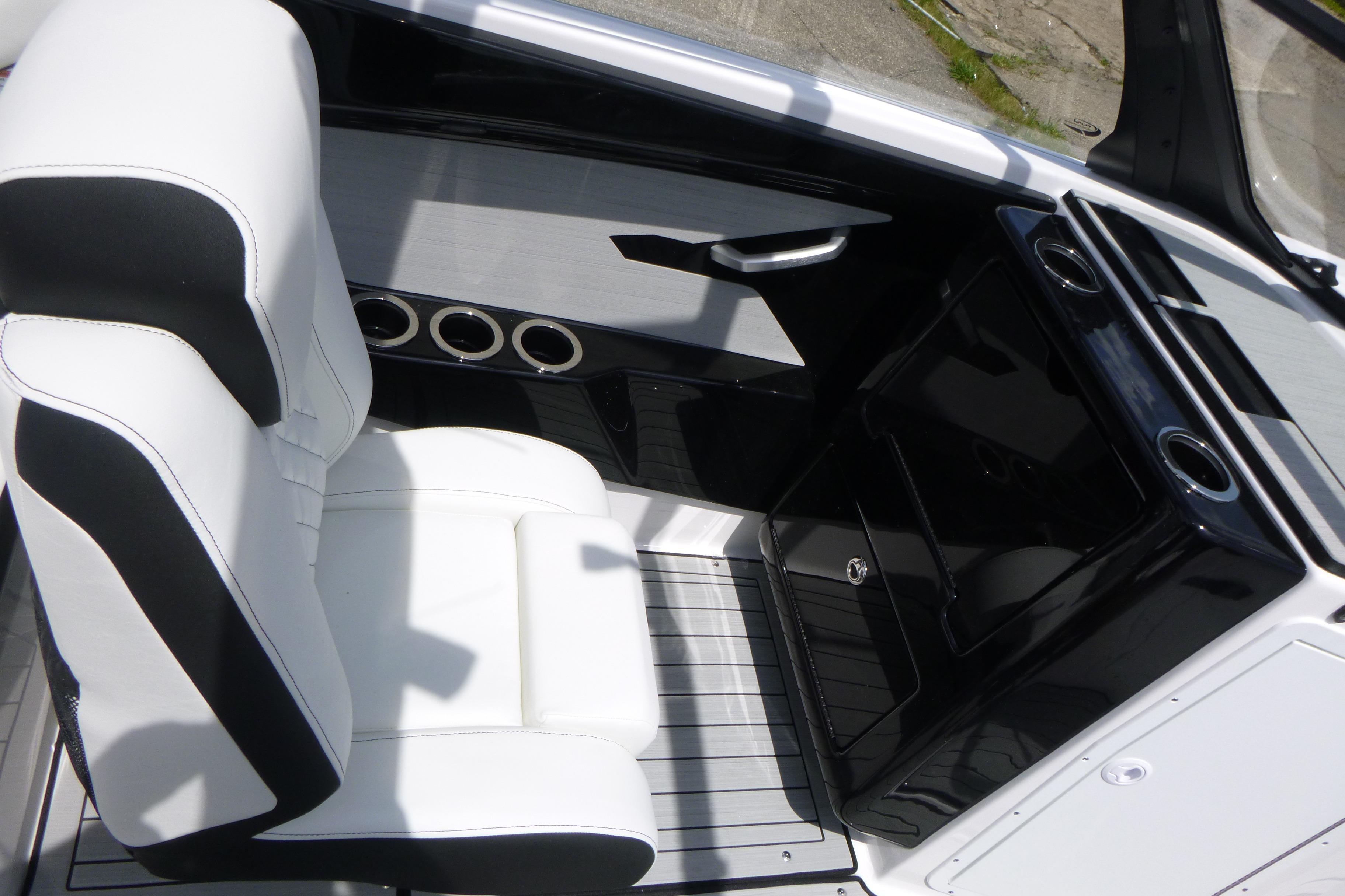 2026 Yamaha Boats 222S interior with white seating and sleek black console design.