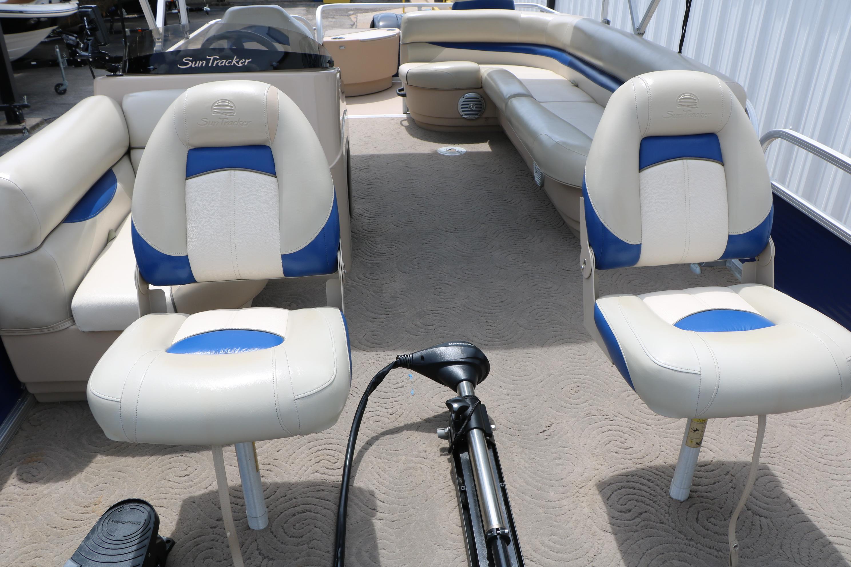 2013 Sun Tracker Fishin' Barge 20 DLX interior with comfortable seating and fishing setup.