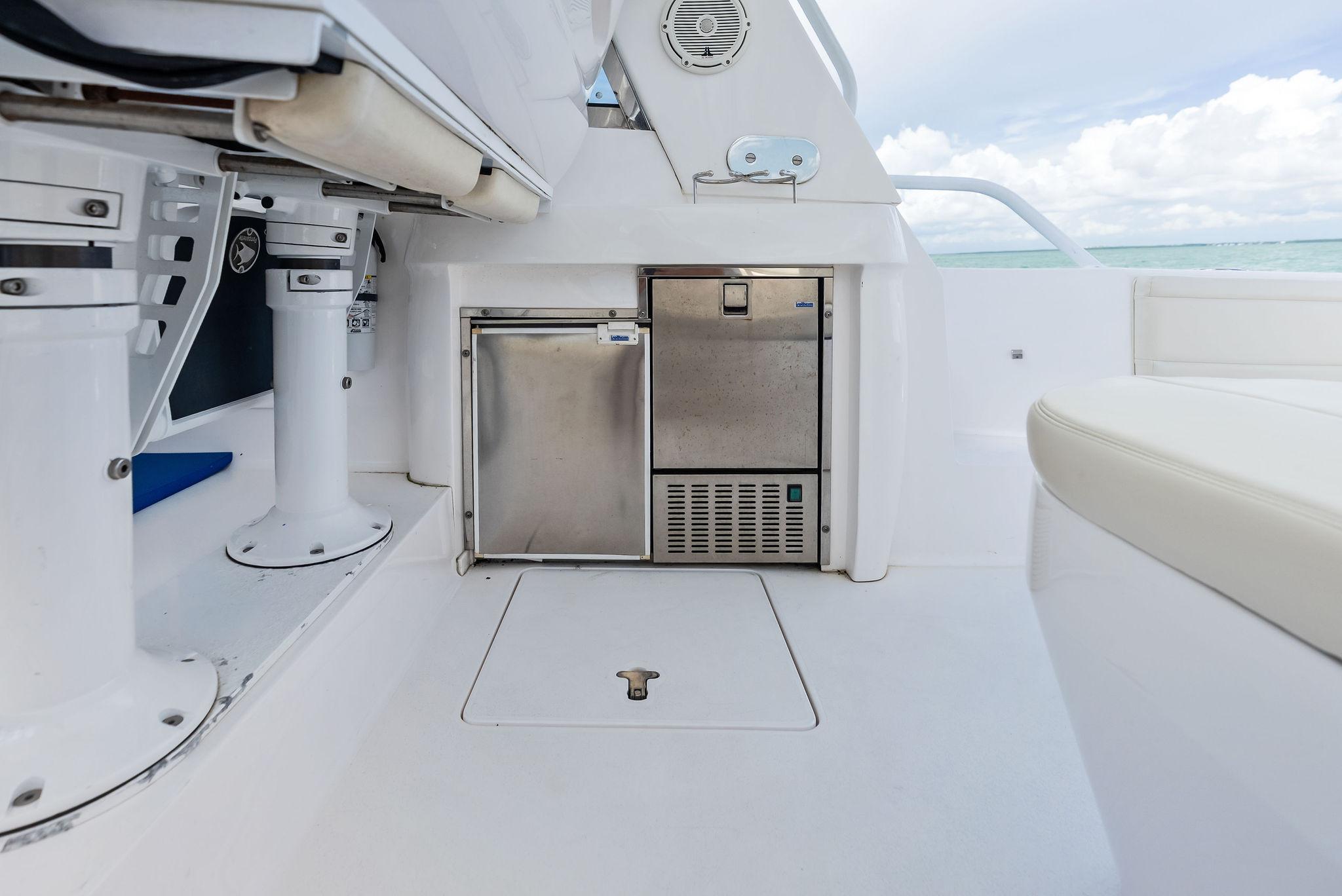 2018 Intrepid 430 Sport Yacht interior with stainless steel appliances and seating.