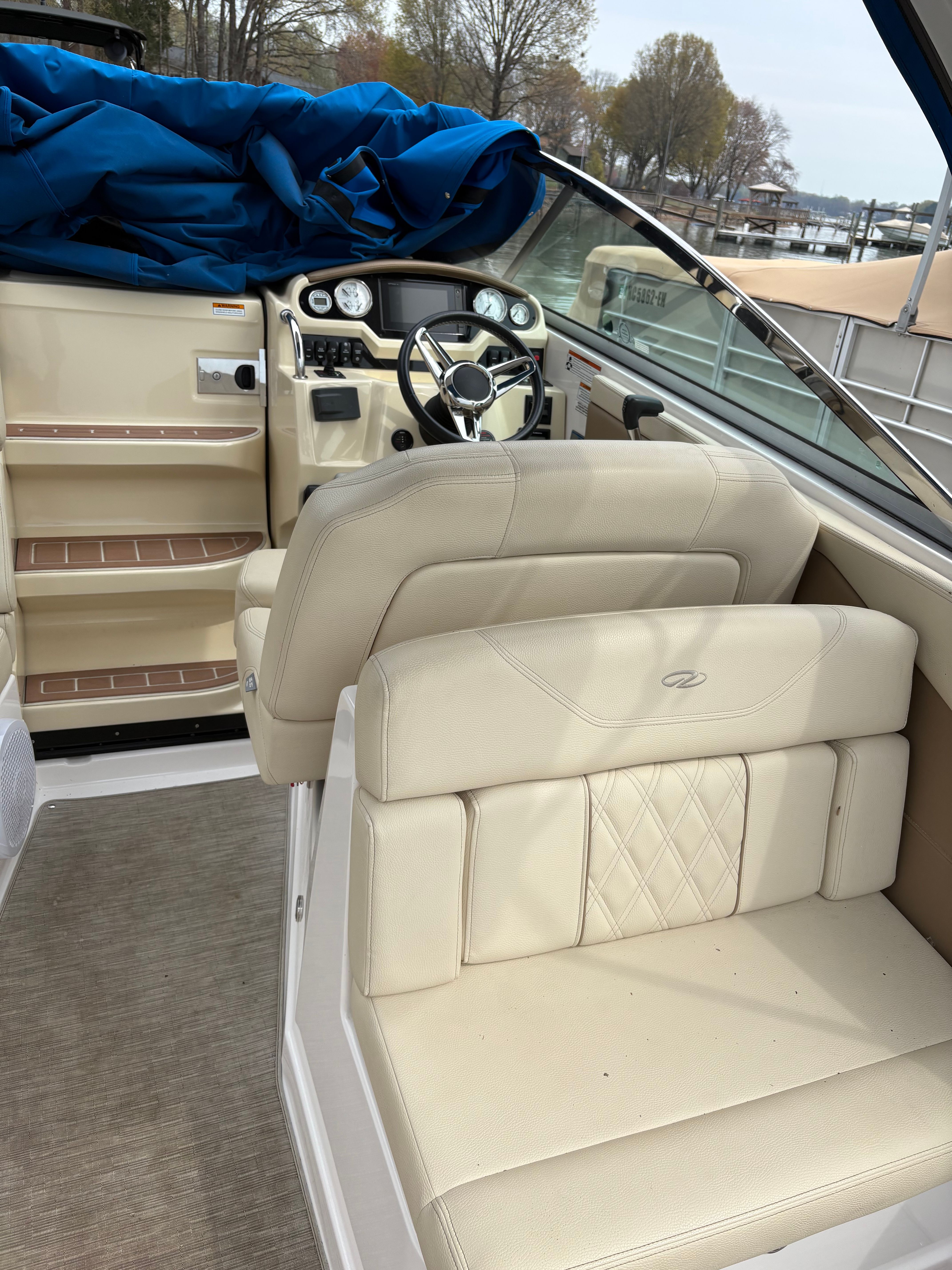 Interior of a 2019 Regal 28 Express boat with beige seating.