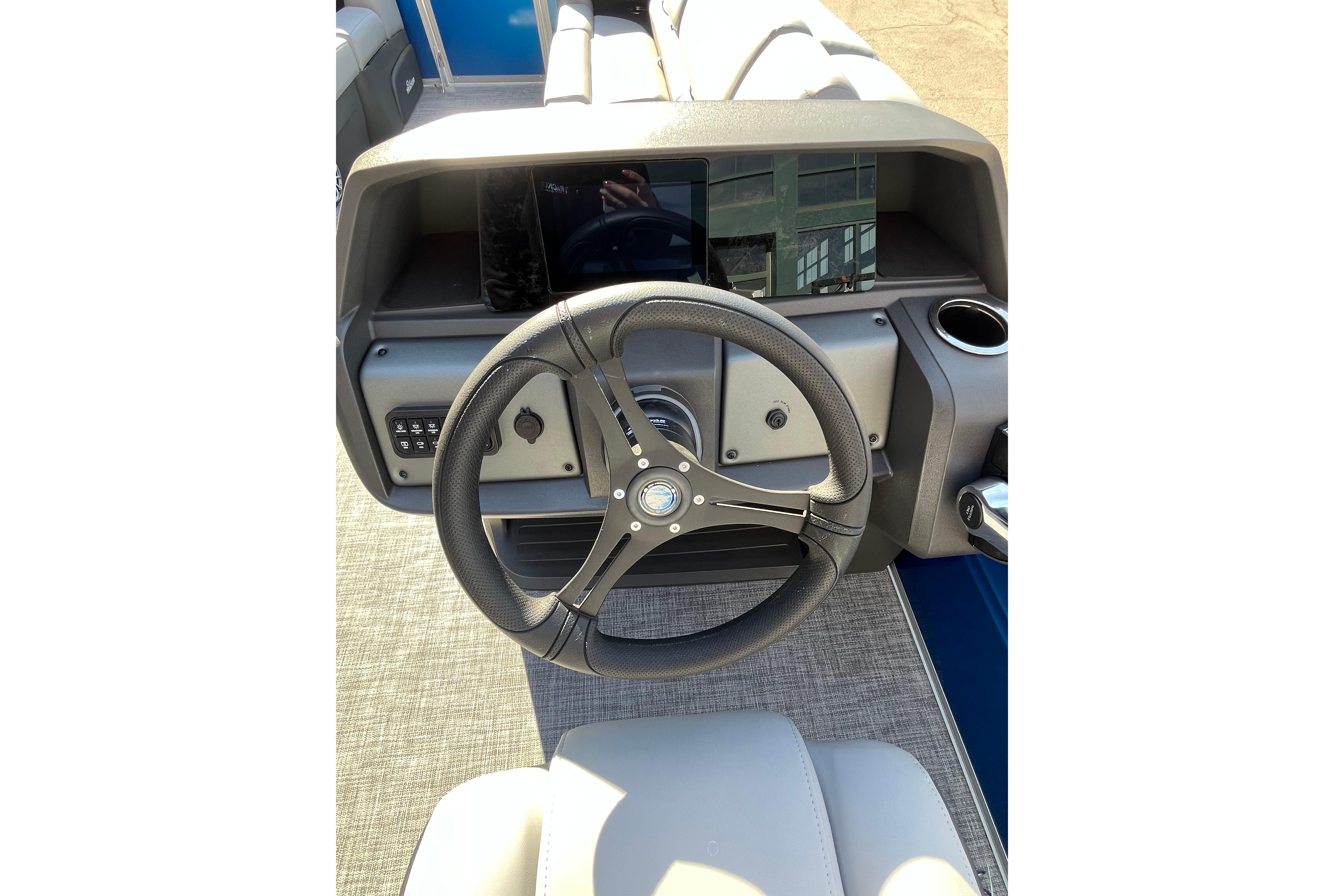 Steering wheel of 2026 Sun Tracker Party Barge 24 XP3 pontoon boat.