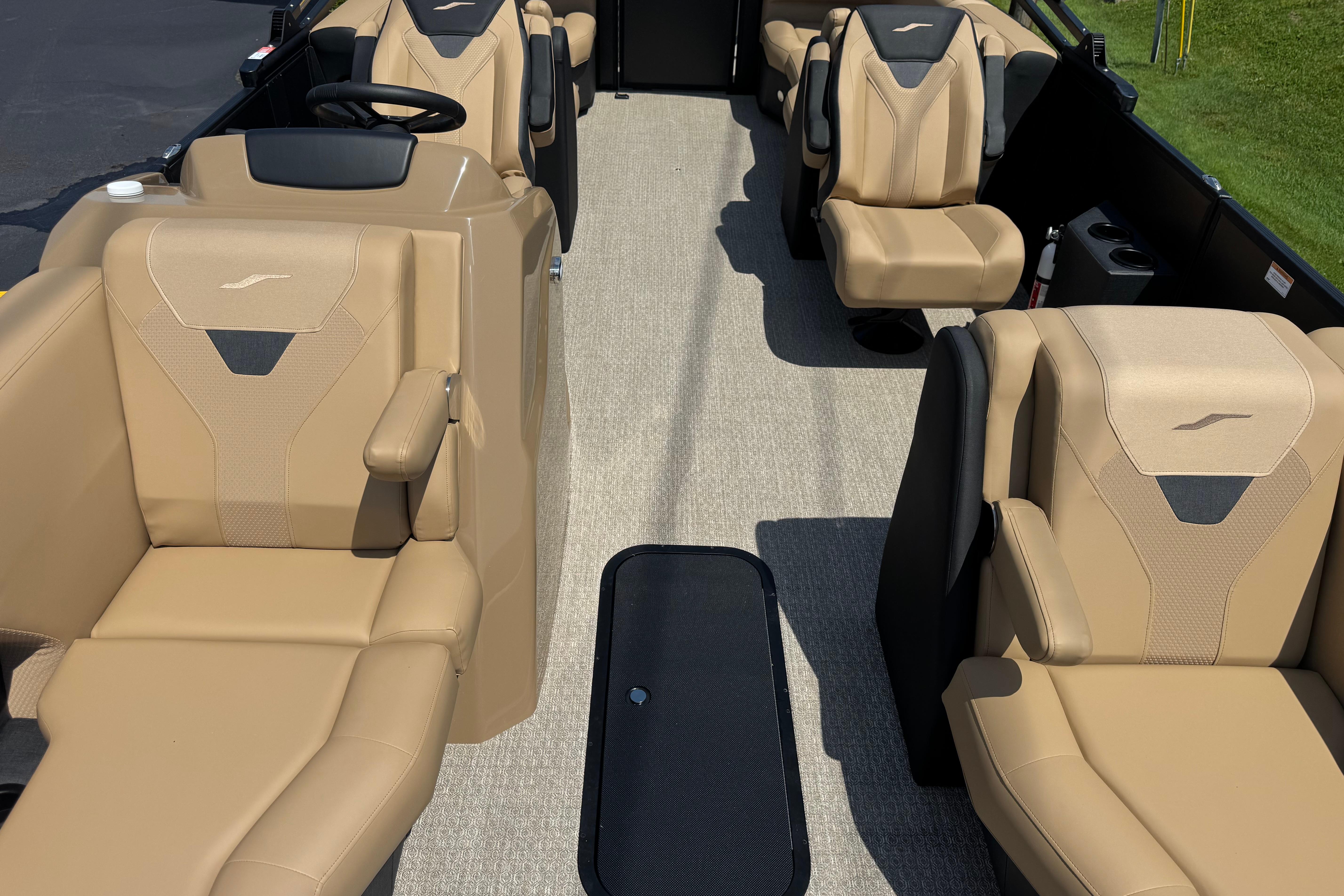 Luxurious interior of 2026 Evotti 525QL boat with beige seating and modern design.