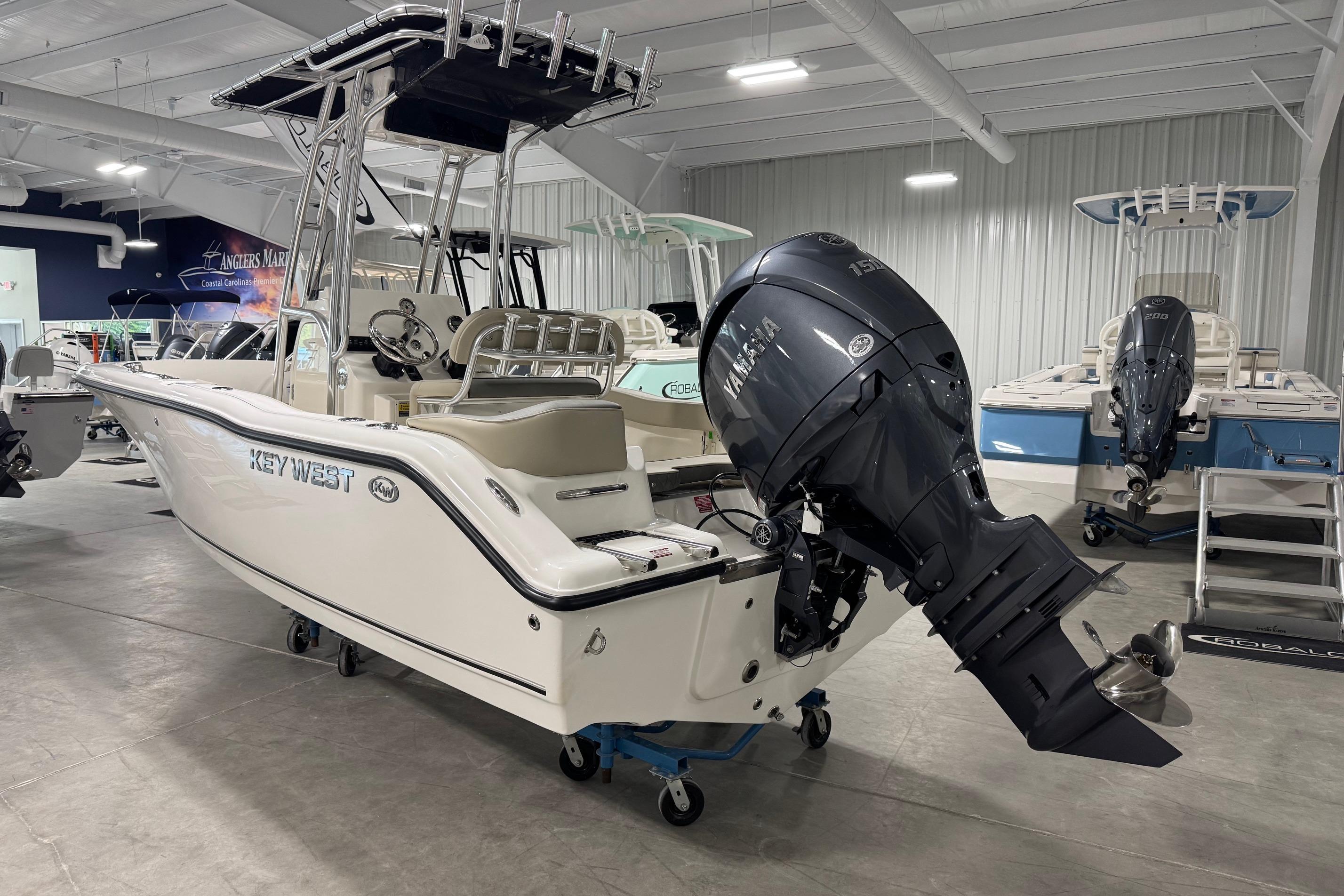2026 Key West 203 FS boat with Yamaha outboard motor in showroom.