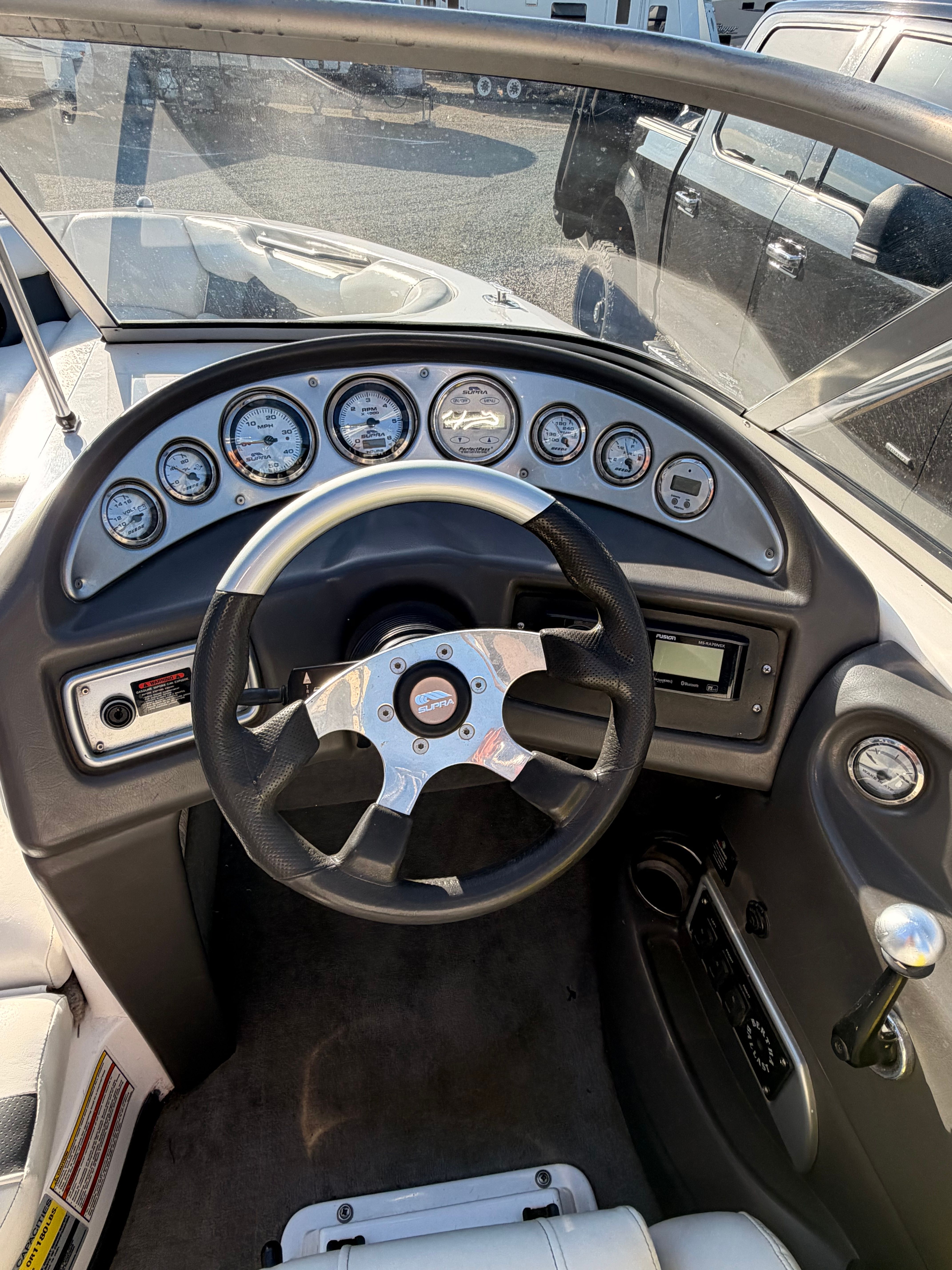 Interior view of a 2004 Supra Launch SSV boat dashboard.