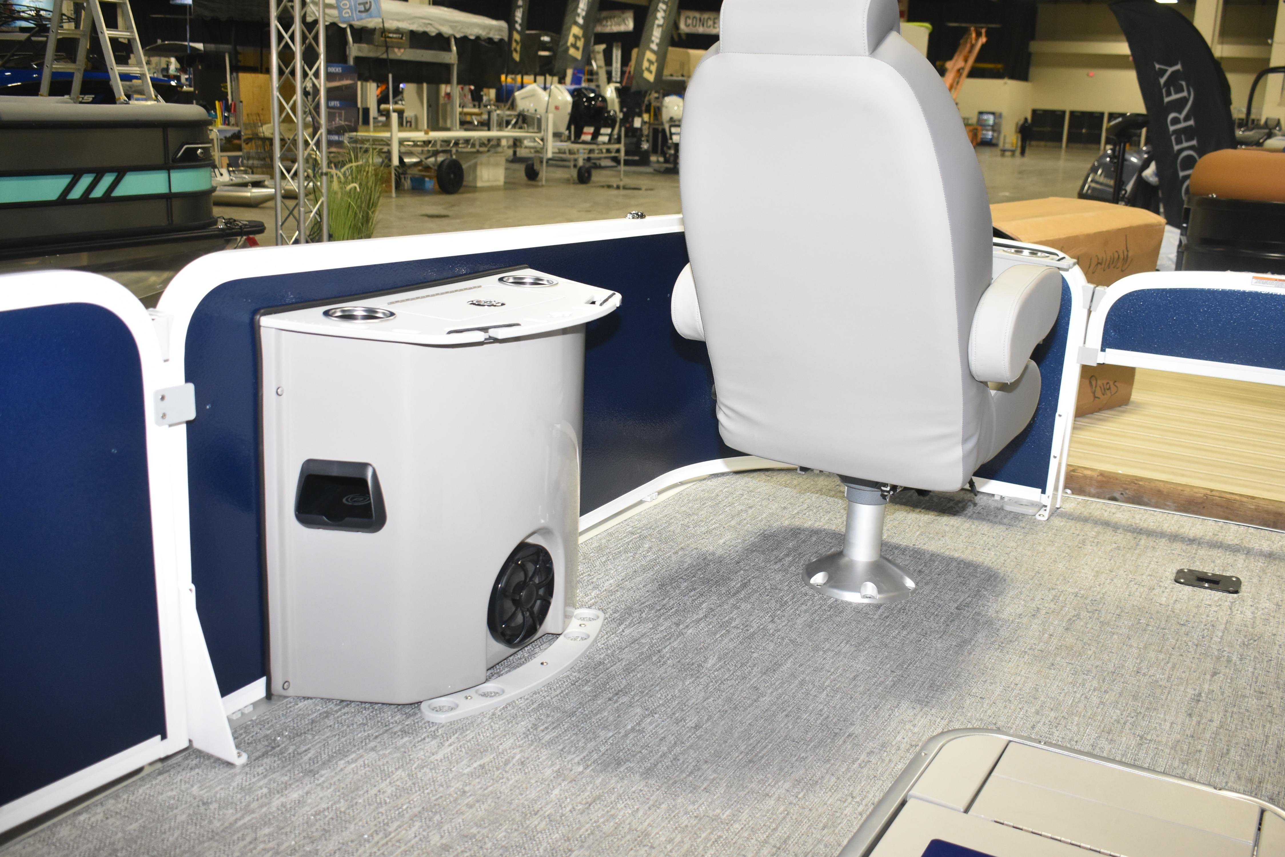 2026 Premier 230 Sunsation Angler 4PT boat interior with seating and storage unit.