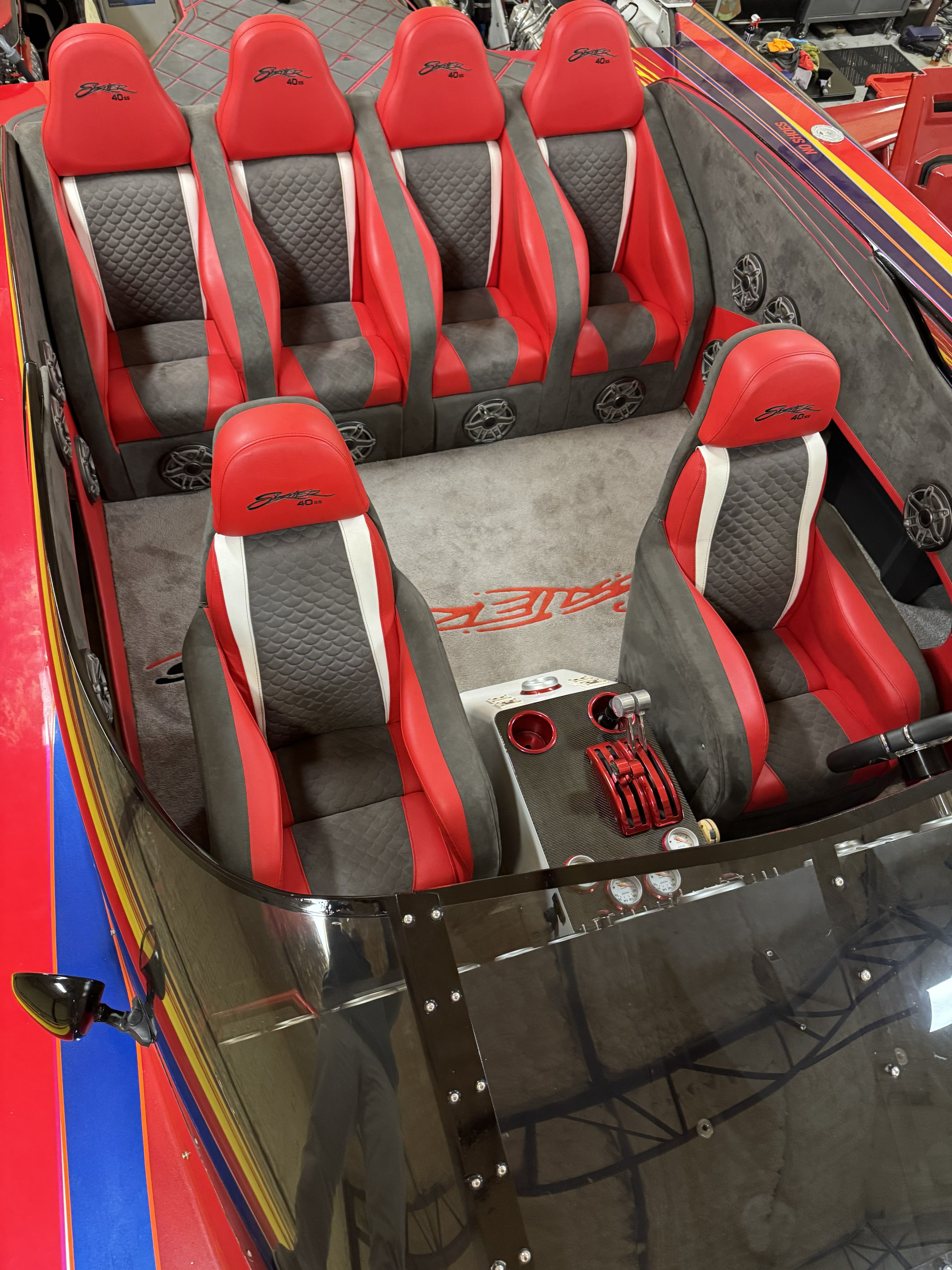 Interior of a 2003 Skater 40 S.S. with red and gray seats.