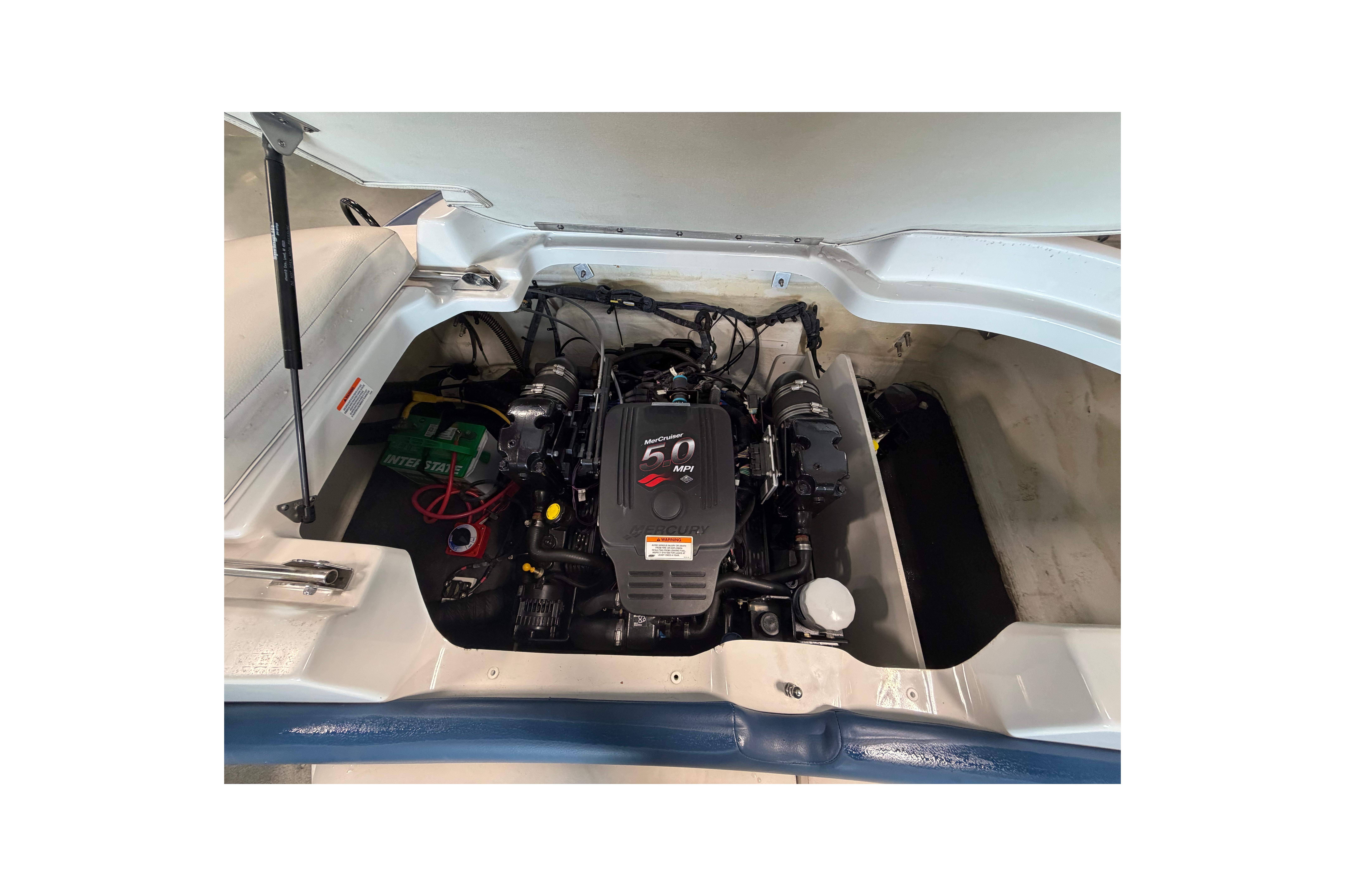 Engine compartment of a 2008 Crownline 220 LS boat, featuring a 5.0 MPI engine.