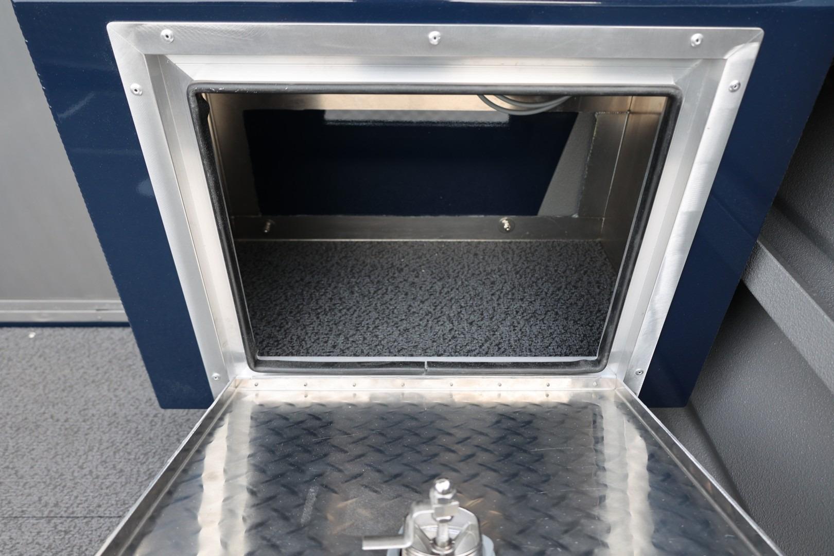 Storage compartment of 2026 Thunder Jet 24 Alexis Pro boat, featuring a metallic finish.