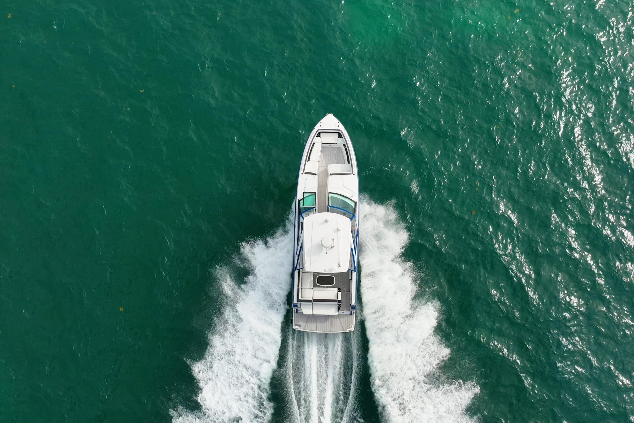 Aerial view of 2021 Monterey 378SE Super Express cruising on turquoise water.